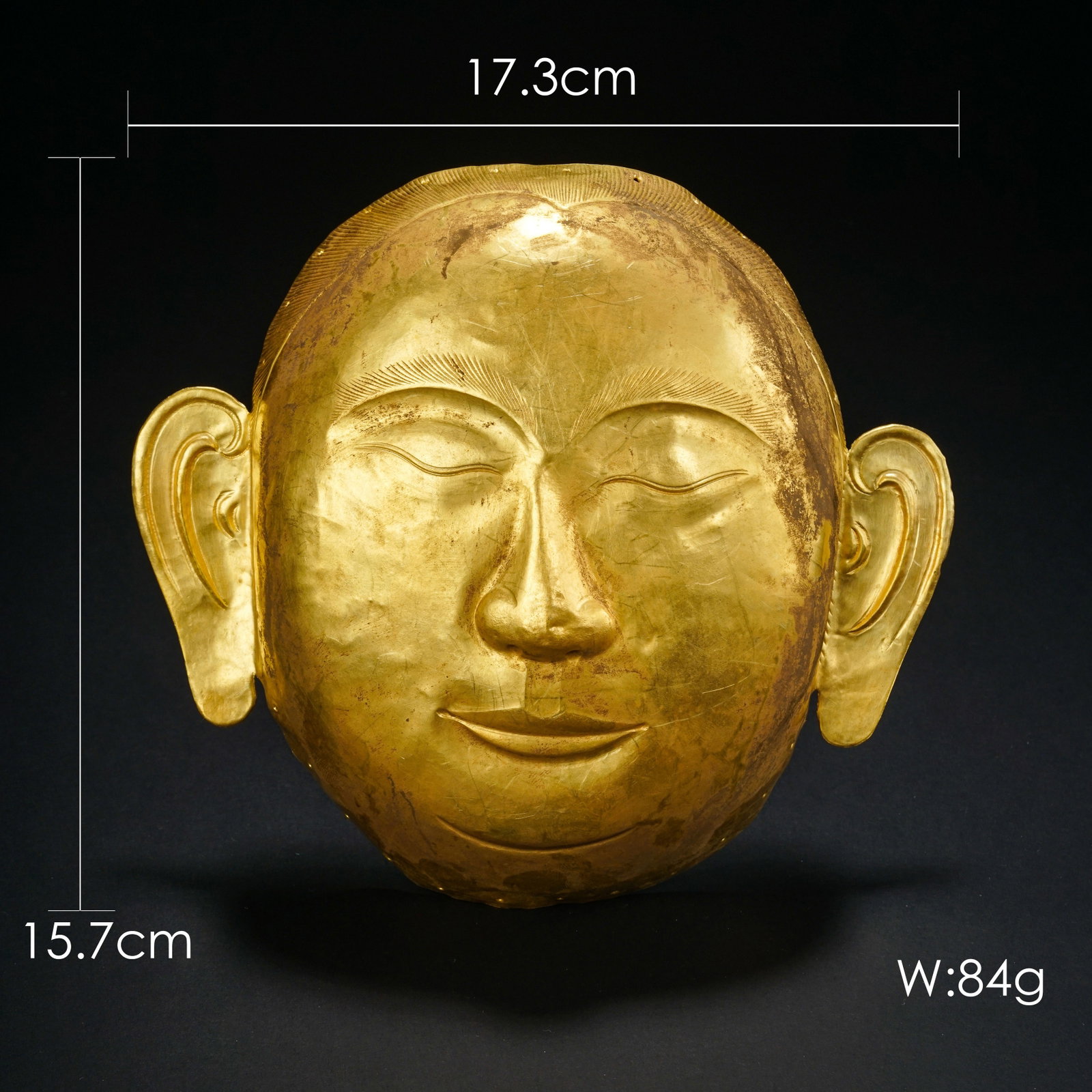 Pure gold mask from the Tang Dynasty in China: H . 15.7 cm . W . 17.3cm . Weight 84 gram .