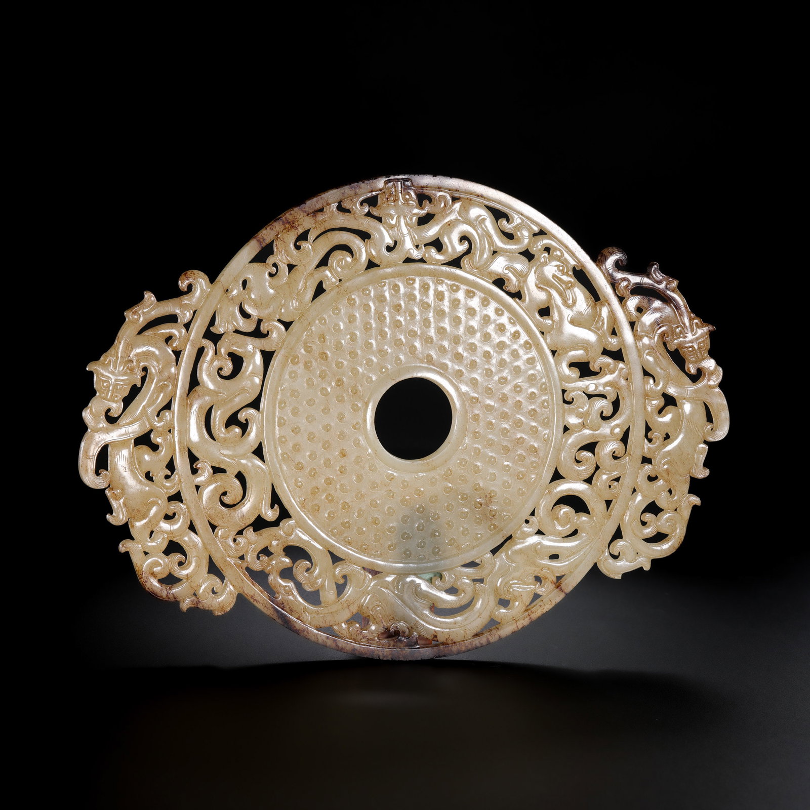 Jade disc from the Han Dynasty in China: H . 17 cm . W . 23.5 cm . Weight 314 gram .