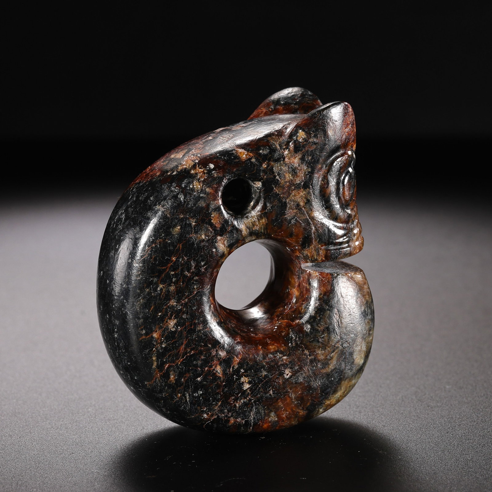 Jade Pig-Dragon from the Hongshan Culture of the Hongshan Period in China: H . 6 cm . W . 4.8 cm . Weight 127 gram .