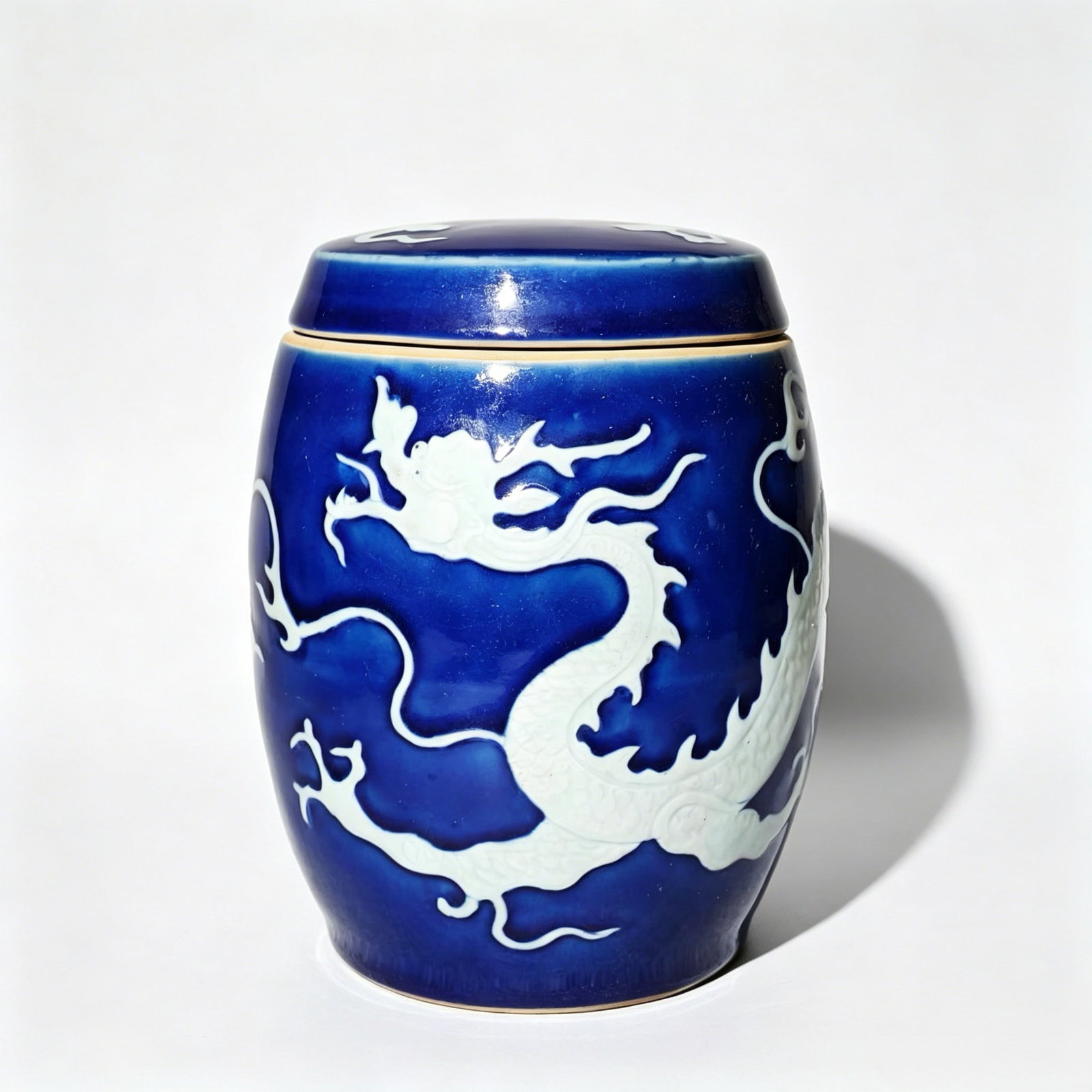 Yuan Dynasty Sacrificial Blue Glaze Lidded Jar with Reserved White Relief Dragon and Cloud Motifs: Yuan Dynasty Sacrificial Blue Glaze Lidded Jar with Reserved White Relief Dragon and Cloud MotifsBasic Collection InformationCategory: High-temperature cobalt blue glazed porcelain with applied relief