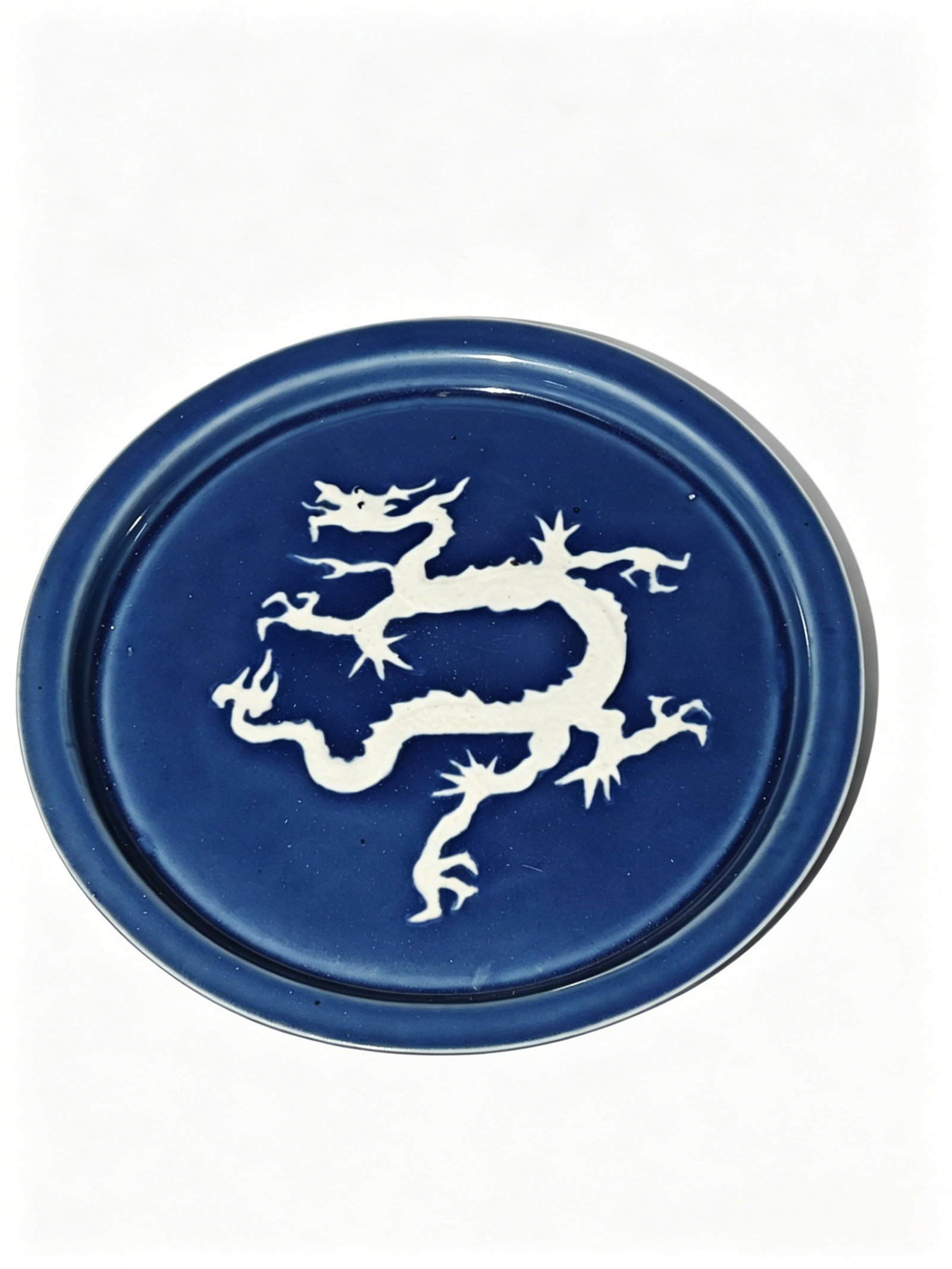 Yuan Dynasty Small Dish with Raised White Dragon Design on Cobalt Blue Glaze: Yuan Dynasty Small Dish with Raised White Dragon Design on Cobalt Blue GlazeBasic Collection InformationCategory: Decorative small porcelain dish with high-temperature cobalt blue glaze and raised whi