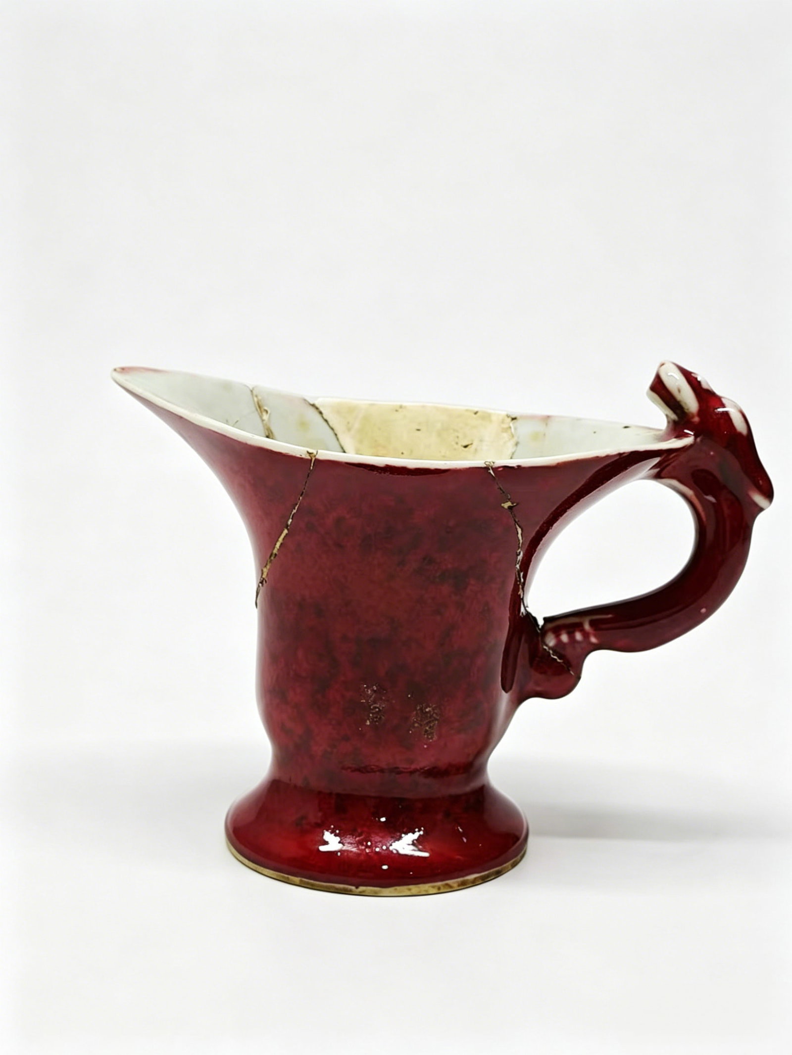 Red-Glazed Dragon-Handled Vessel Imitating Bronze Jue Cup: Red-Glazed Dragon-Handled Vessel Imitating Bronze Jue CupBasic InformationObject Name: Flambe Langyao Red-Glazed Jue-Style Cup with Dragon HandleMark: A four-character regular script mark "Xuande Nian
