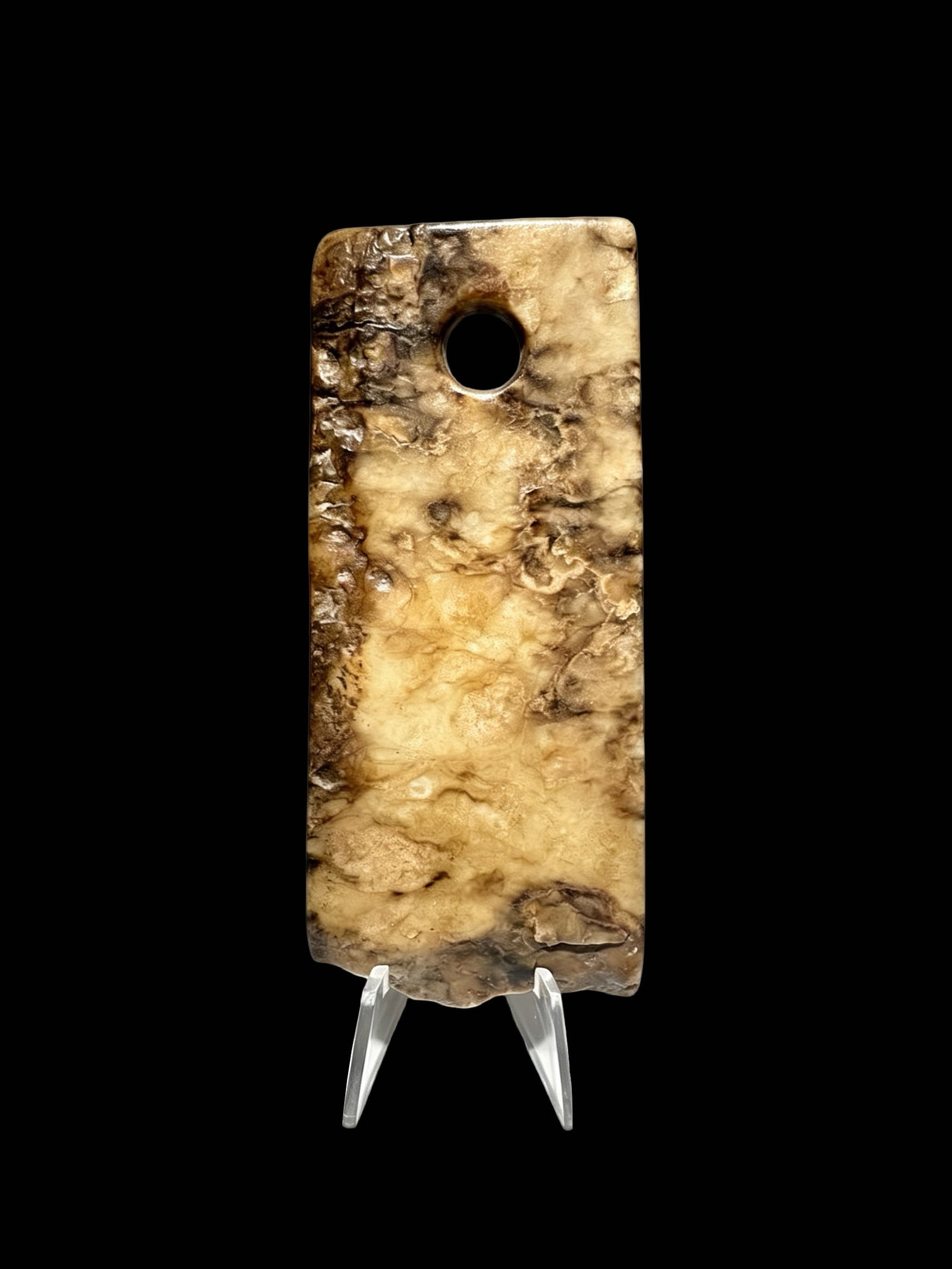 Qijia Culture Jade Spade Proposed Date: Ritual jade spade of the Qijia Culture: Dimensions: Length 11.7 cm (4.61 inches), width 5.07 cm (2.00 inches); a trapezoidal flat ritual jade implement with a central circular suspension bore drilled at the upper sectionFunction: A core rit
