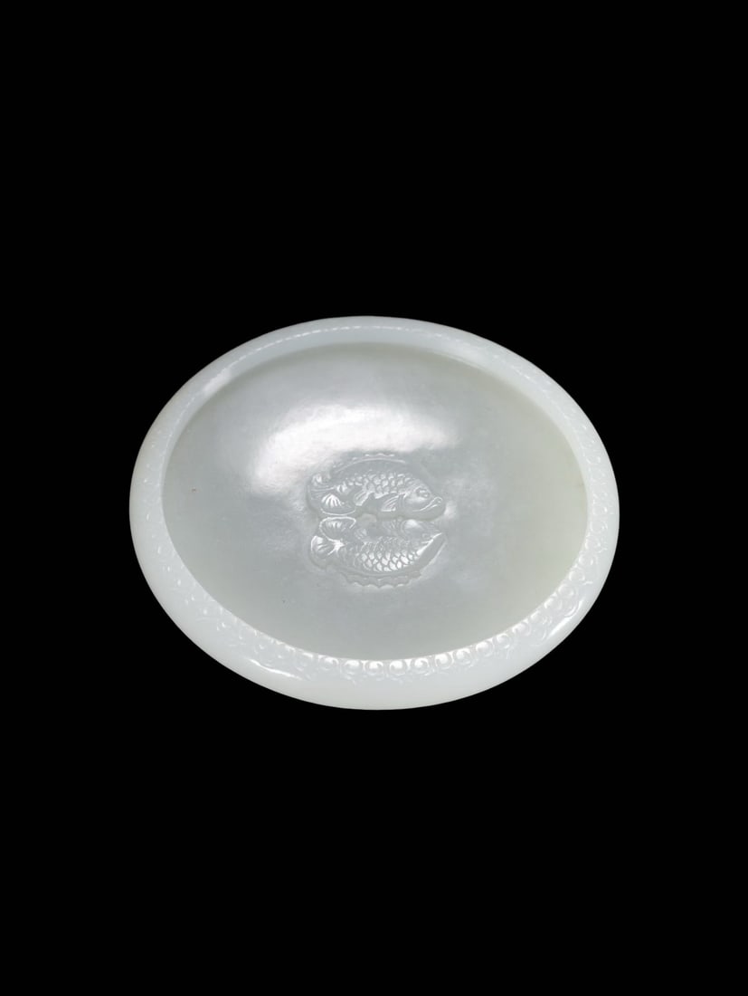 Qianlong Period White Hetian Jade Miniature Dish with Relief Twin Fish and Cloud Scroll Motifs: Qianlong Period White Hetian Jade Miniature Dish with Relief Twin Fish and Cloud Scroll MotifsI. Period AttributionQianlong Reign, Qing Dynasty, White Hetian Jade Scholar’s Dish Decorated with Relie