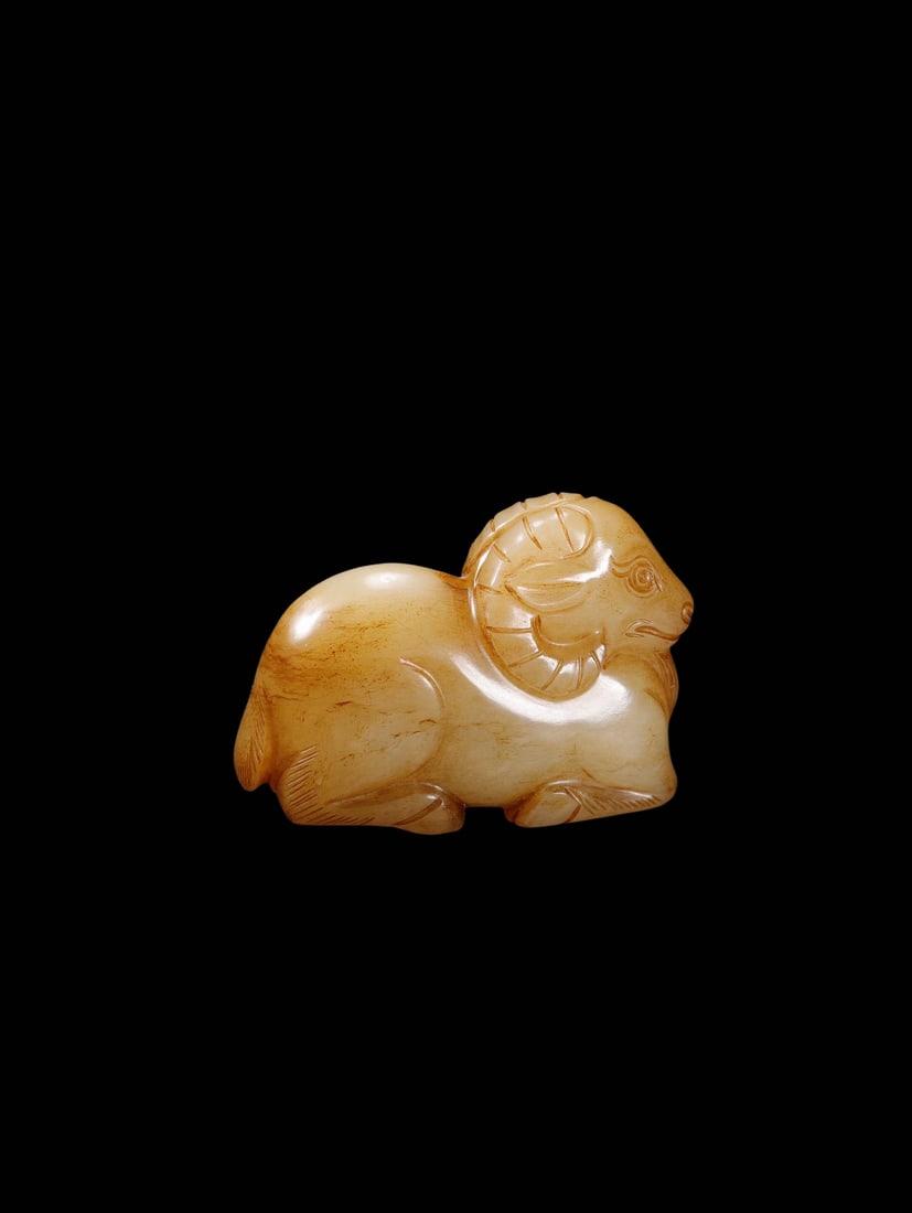 Mid-Qing Period White Hetian Jade Handpiece of Recumbent Zodiac Sheep Naturally Permeated by (1 of 9)