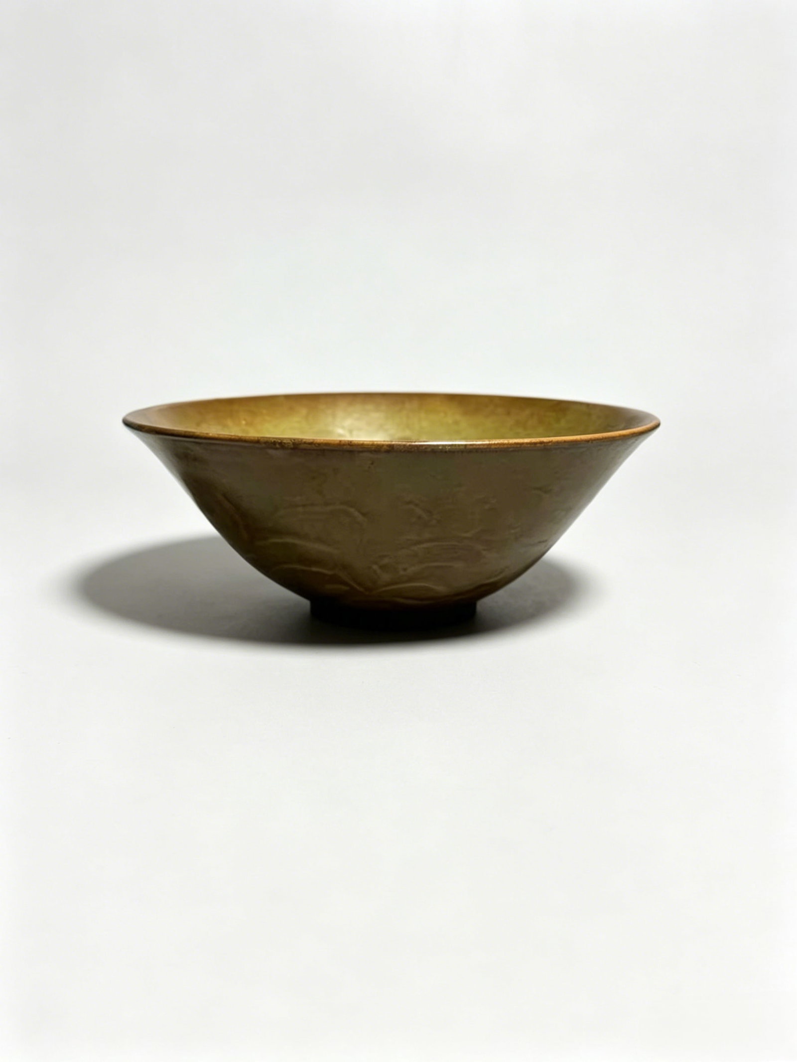 Conical Tea Bowl Carved with Interlocking Peony Scrolls under Olive-Yellow Glaze, Yaozhou Kiln (1 of 5)