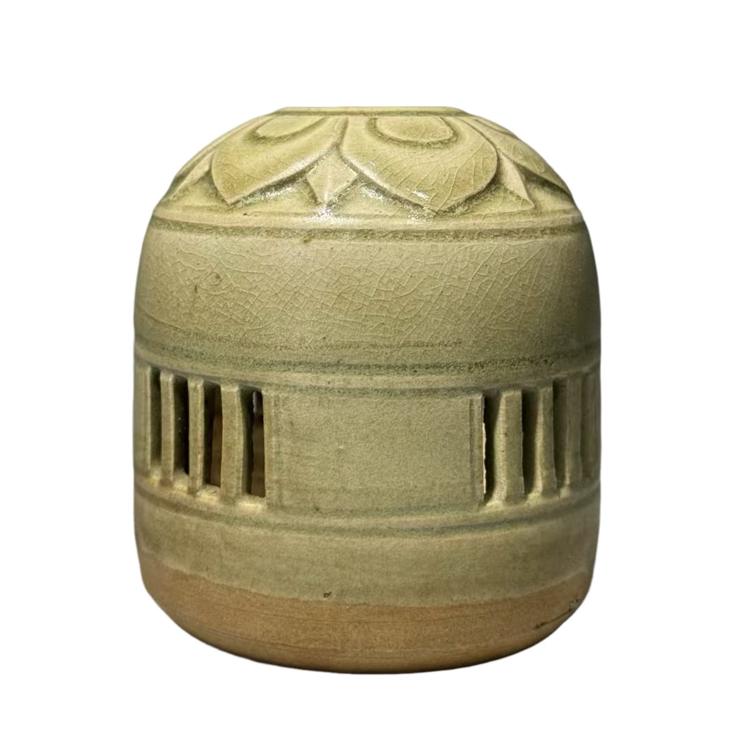Celadon Incense Burner with Carved Lotus Petals and Openwork Cutouts: Celadon Incense Burner with Carved Lotus Petals and Openwork CutoutsBasic Collection InformationKiln Line: Yue Kiln CeladonPeriod: Northern and Southern Dynasties to Sui DynastyOverall Height: 10.2 cm