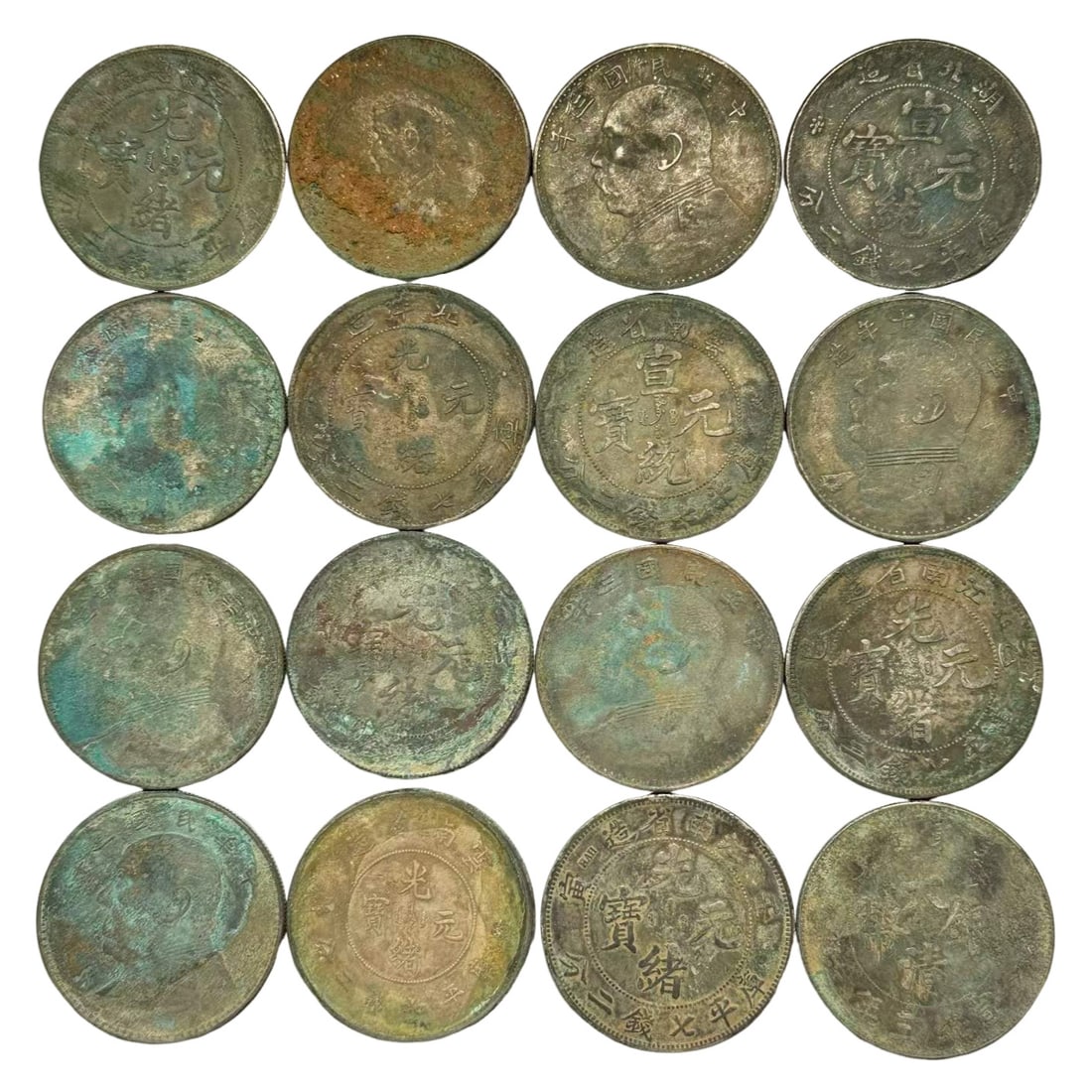 A Group of Sixteen Unearthed One-Yuan Machine-Struck Pure Silver Dollars, Qing to Republic of China (1 of 2)