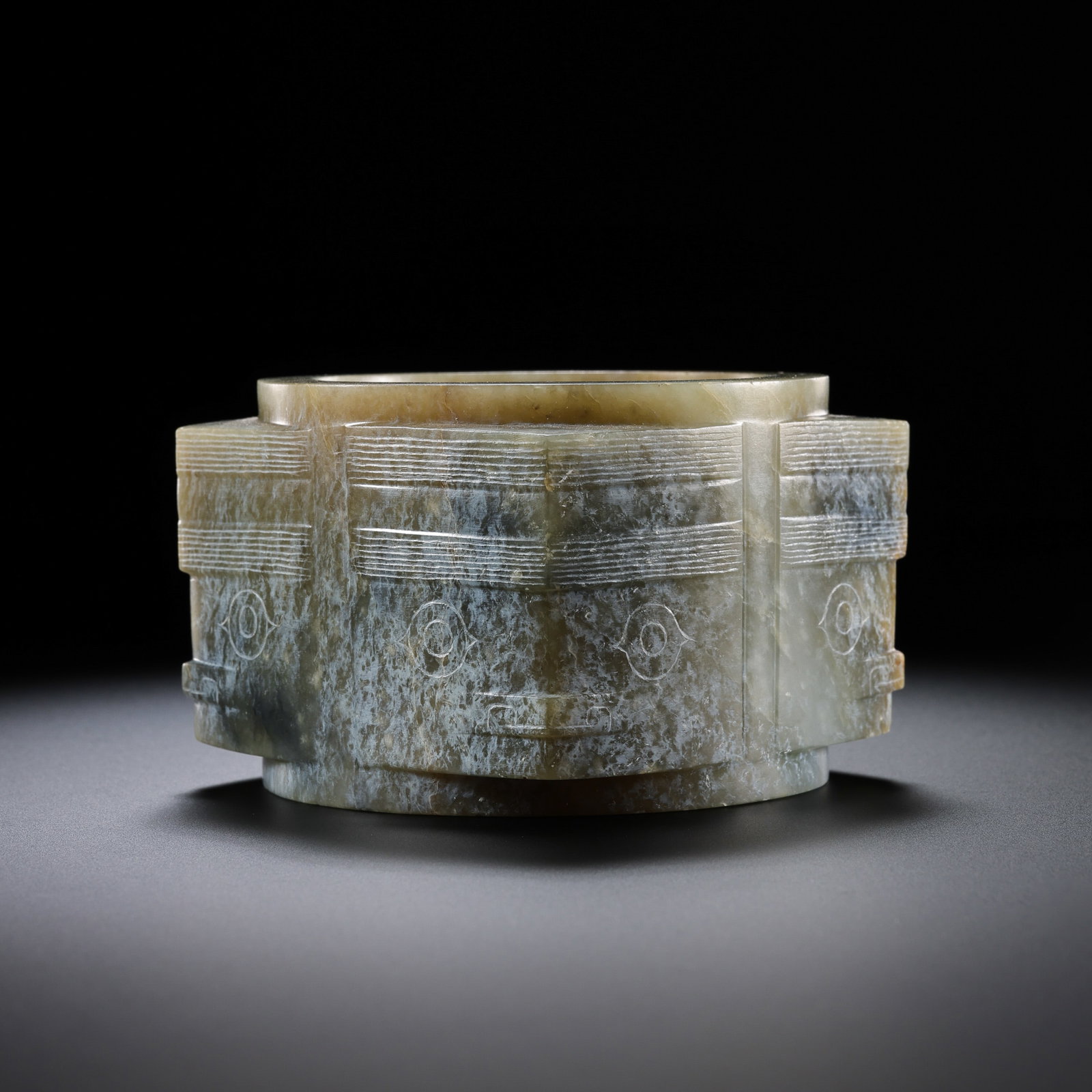 Jade Cong with Animal Mask Pattern from the Neolithic Period in China: H . 5 cm . L . 7.2 cm . Weight 349 gram .