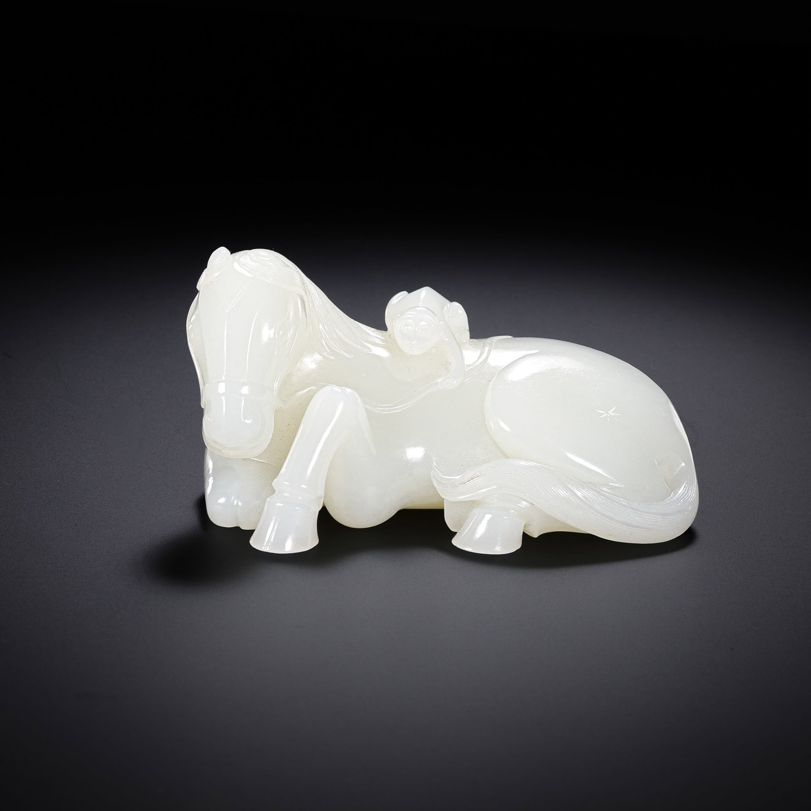 Chinese Qing Dynasty Hetian white jade reclining horse: H . 5 cm . L . 9 cm . Weight 247 gram .