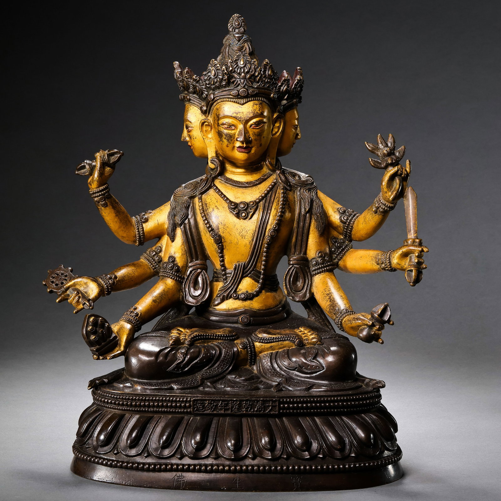A partially gilt bronze Buddhist statue from the Qianlong period of the Qing Dynasty in China.: H . 31 cm . L . 24 cm . Weight 6041 gram .