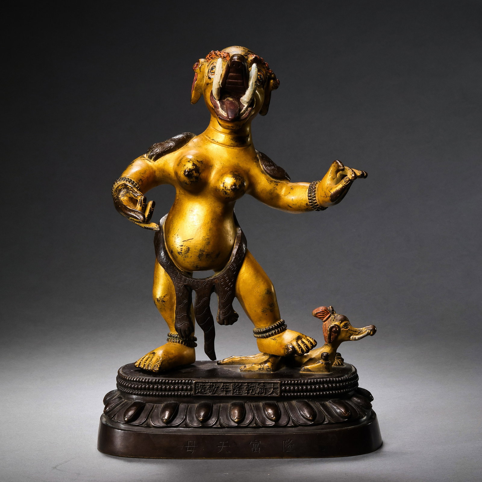 A partially gilt bronze Buddhist statue from the Qianlong period of the Qing Dynasty in China.: H . 25 cm . L . 17.5 cm . Weight 3331 gram .