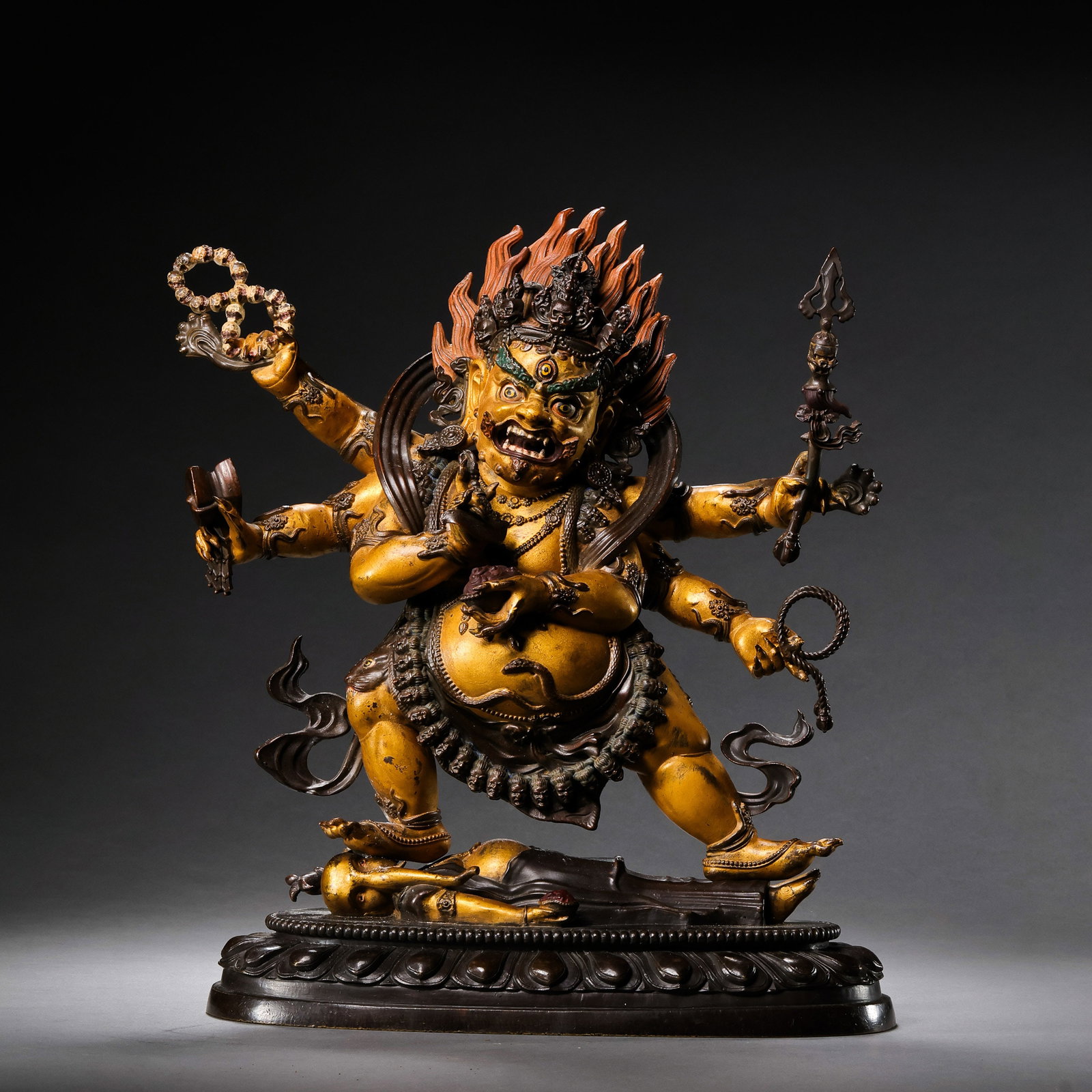 A partially gilt bronze Buddhist statue from the Qianlong period of the Qing Dynasty in China.: H . 26.5 cm . L . 25 cm . Weight 4168 gram .