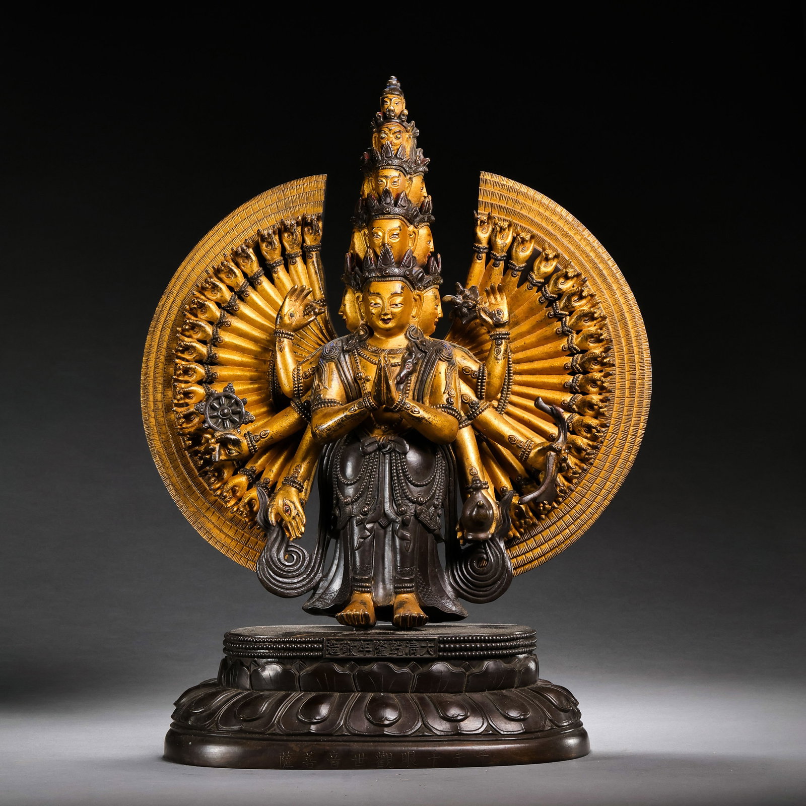 A partially gilt bronze Buddhist statue from the Qianlong period of the Qing Dynasty in China.: H . 33 cm . L . 24.5 cm . Weight 6496 gram .