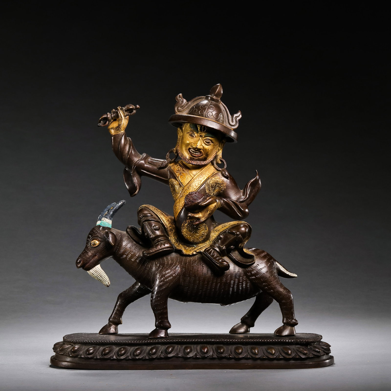 A partially gilt bronze Buddhist statue from the Qianlong period of the Qing Dynasty in China.: H . 21 cm . L . 20.5 cm . Weight 1748 gram .