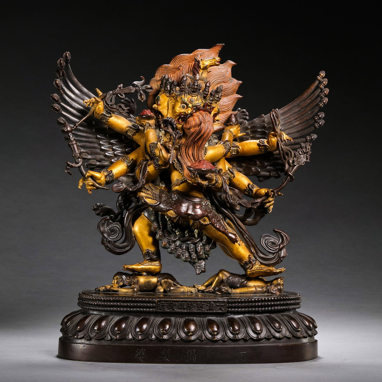 A partially gilt bronze Buddhist statue from the Qianlong period of the Qing Dynasty in China.: H . 24.5 cm . L . 22 cm . Weight 4737 gram .