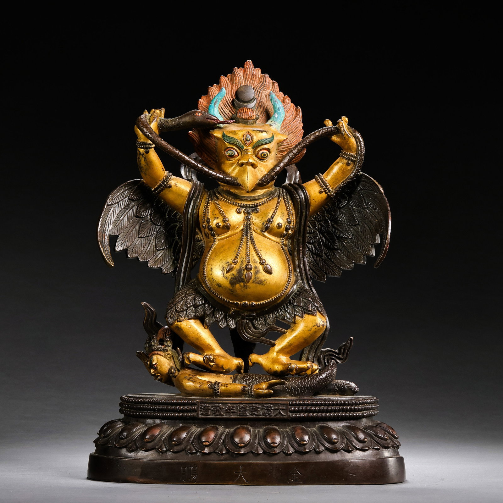 A partially gilt bronze Buddhist statue from the Qianlong period of the Qing Dynasty in China.: H . 27 cm . L . 18.5 cm . Weight 4009 gram .