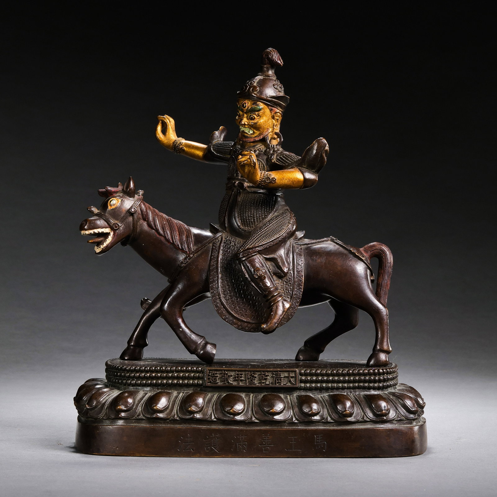 A partially gilt bronze Buddhist statue from the Qianlong period of the Qing Dynasty in China.: H . 20.5 cm . L . 19.5 cm . Weight 2561 gram .