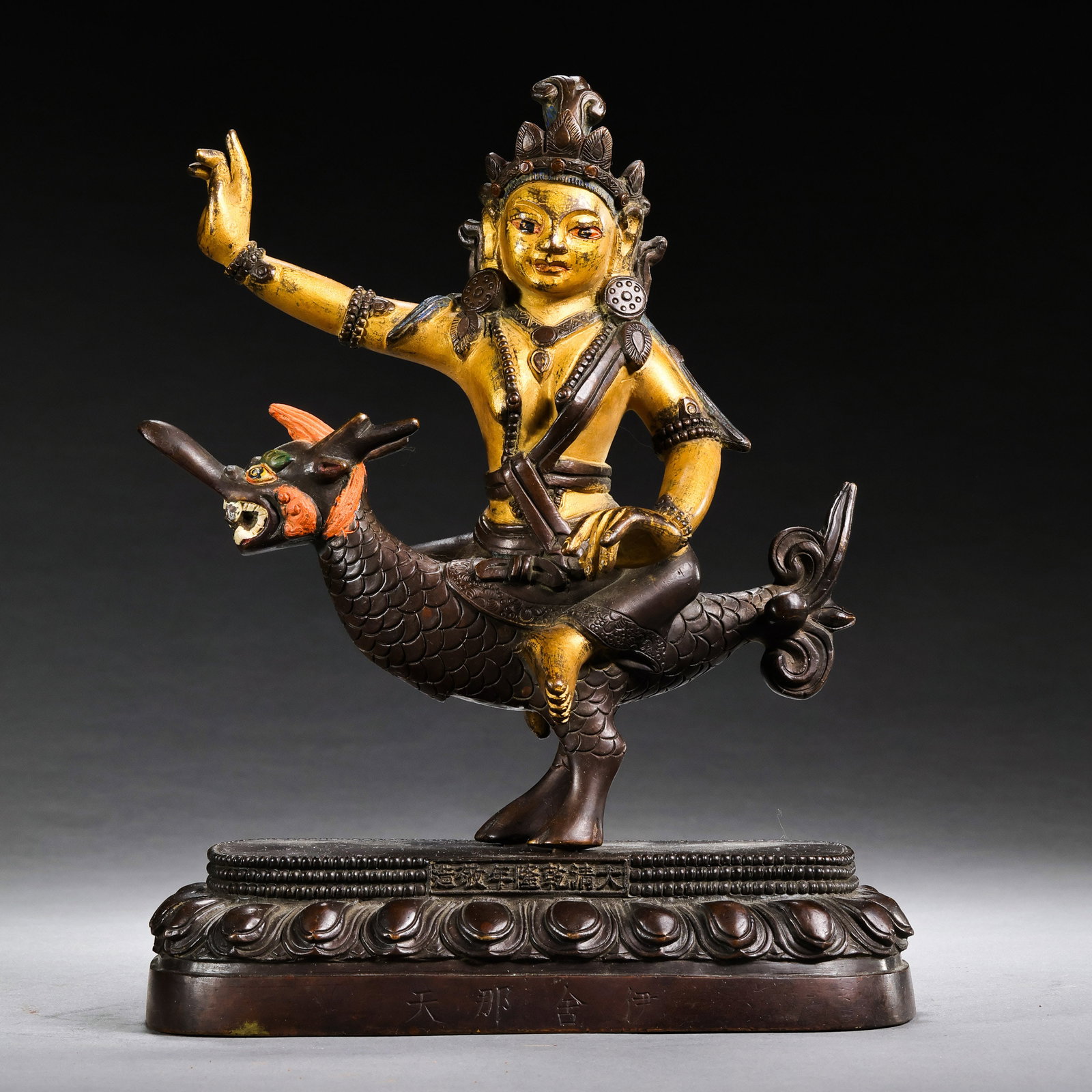 A partially gilt bronze Buddhist statue from the Qianlong period of the Qing Dynasty in China.: H . 18.5 cm . L . 14.5 cm . Weight 1410 gram .