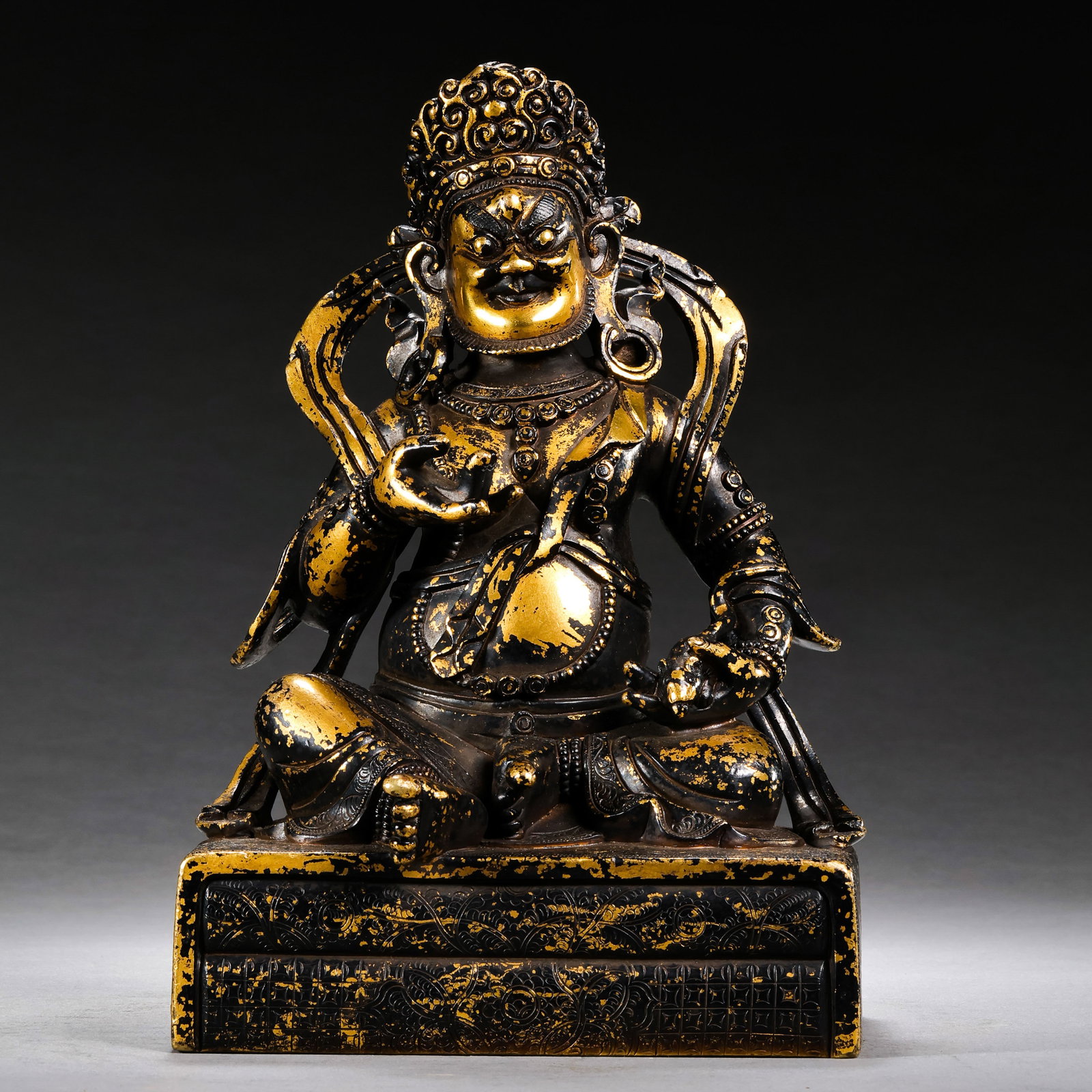A gilt bronze seated statue of the God of Wealth from the Ming Dynasty of China.: H . 28.5 cm . L . 12.5 cm . Weight 3020 gram .