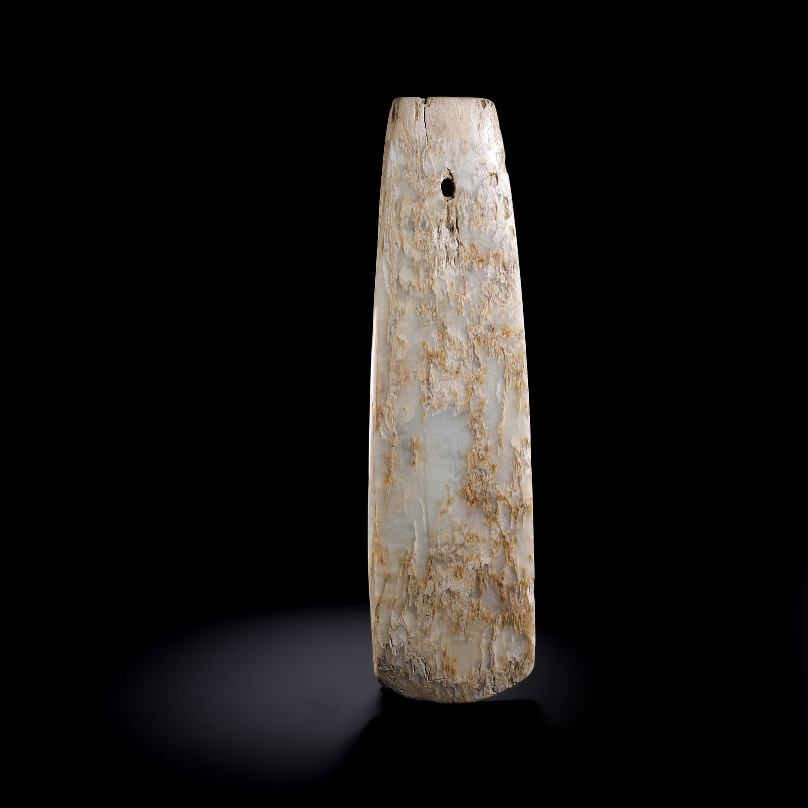 Jade artifacts from the Neolithic period in China: L . 28 cm . W . 8 cm . Weight 623 gram .