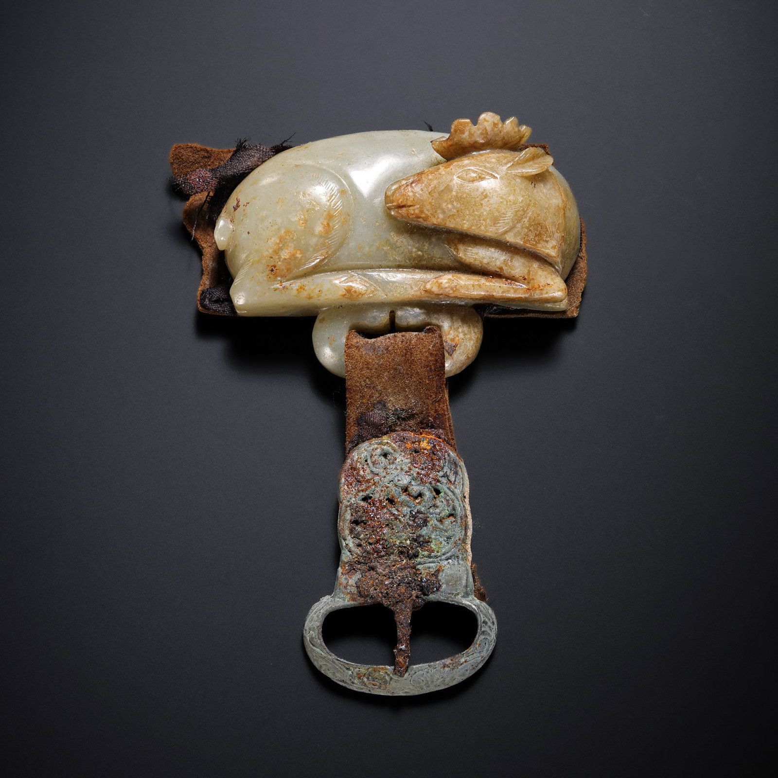 Jade belt buckle from the Liao Dynasty in China: L . 4 cm . W . 8.5 cm . Weight 195 gram .
