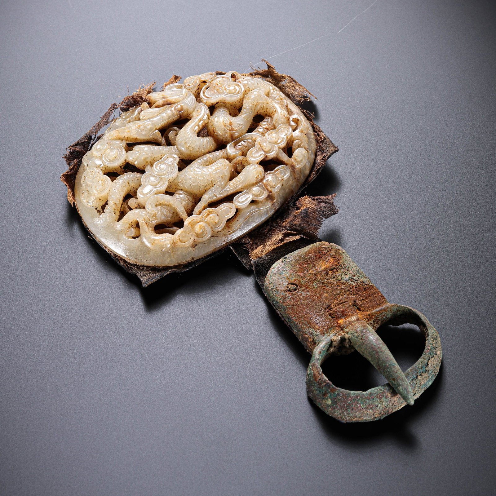 Jade belt buckle from the Liao Dynasty in China: L . 6 cm . W . 8 cm . Weight 145 gram .