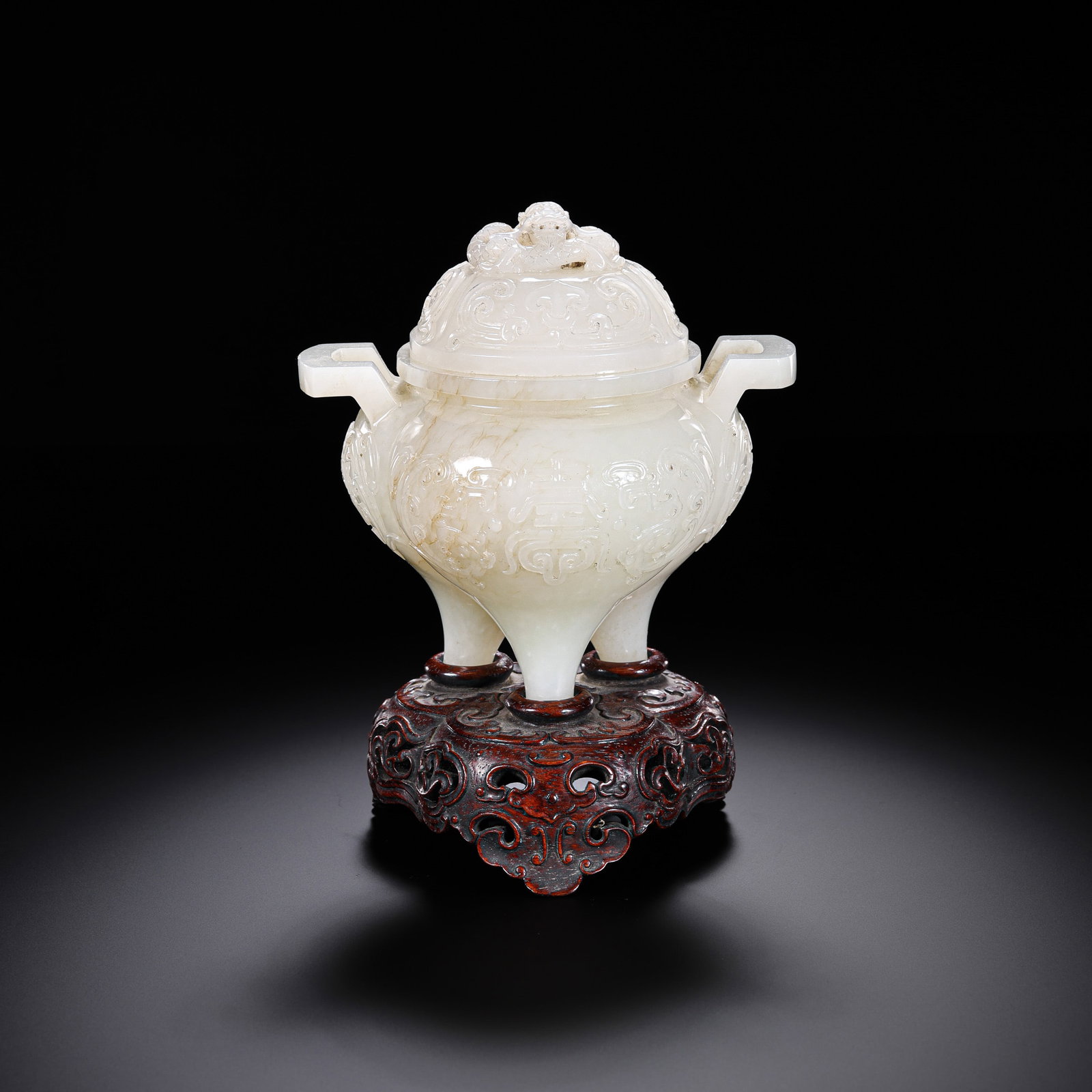 Chinese Qing Dynasty Hetian white jade incense burner with double handles and three legs: H . 11 cm . L . 11.5 cm . Weight 410 gram .