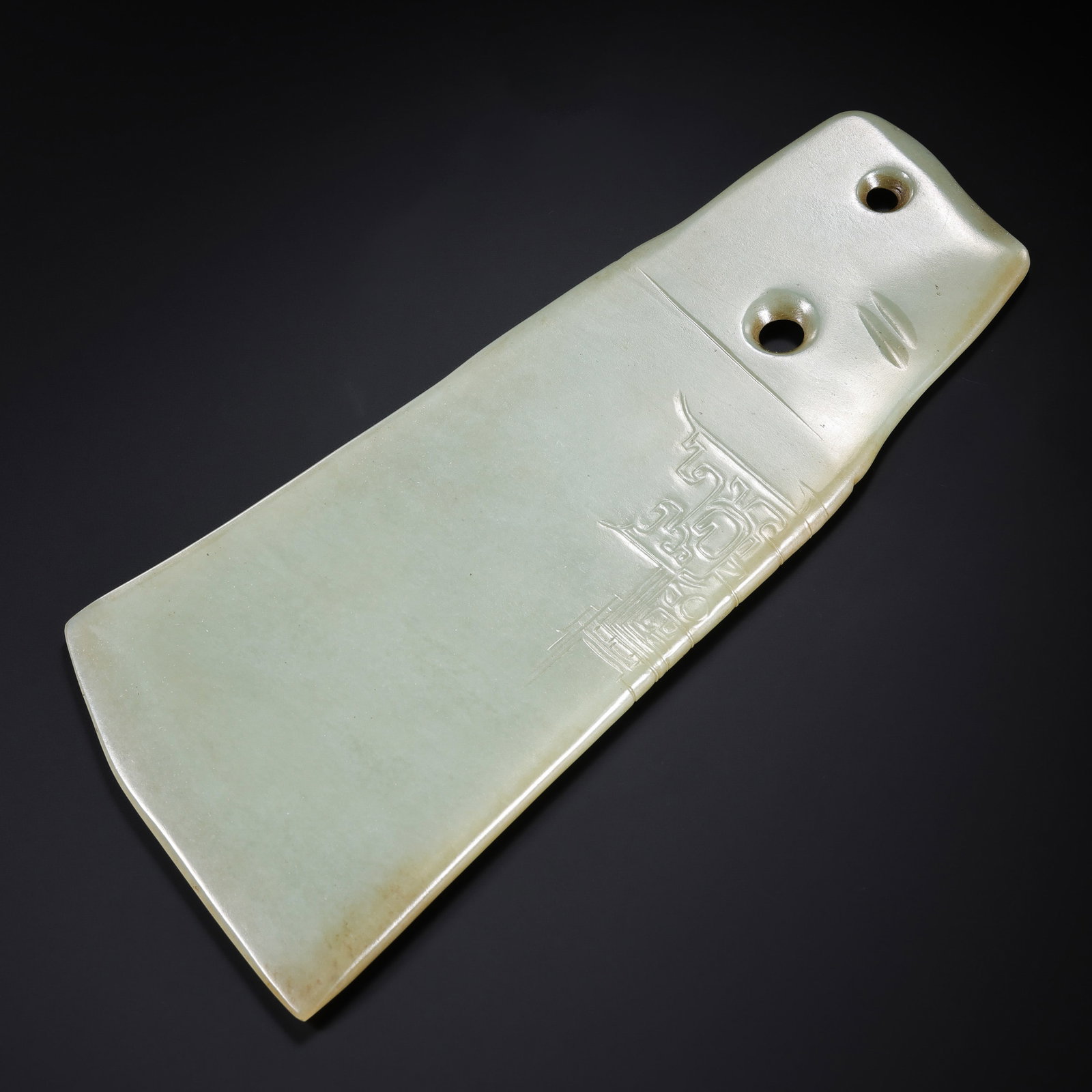 Jade artifacts from the Neolithic period in China: L . 23 cm . W . 10.5 cm . Weight 346 gram .