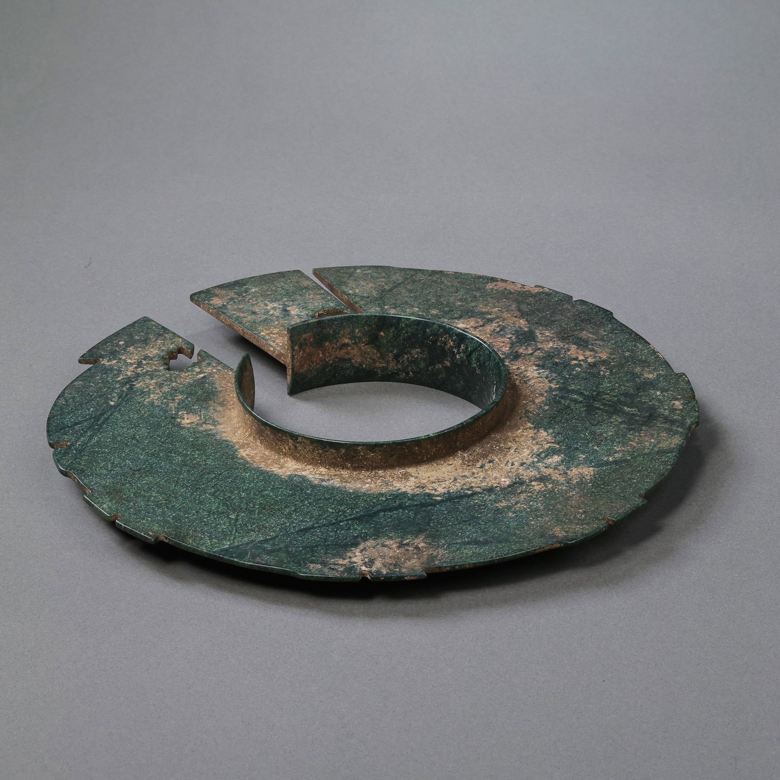 Jade artifacts from the Neolithic period in China: Diam . 20.5 cm Weight 258 gram .