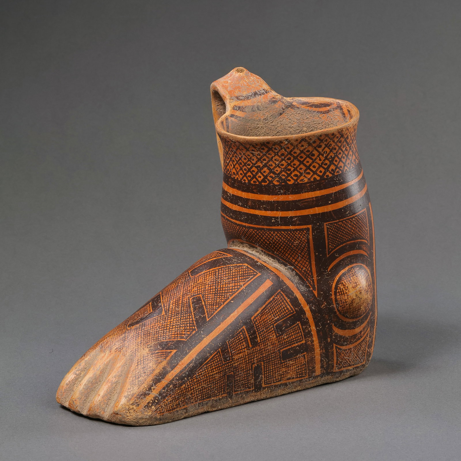 Painted pottery jar from the Majiayao culture of the Neolithic period in China: H . 16 cm . L . 17.5 cm . Weight 531 gram .