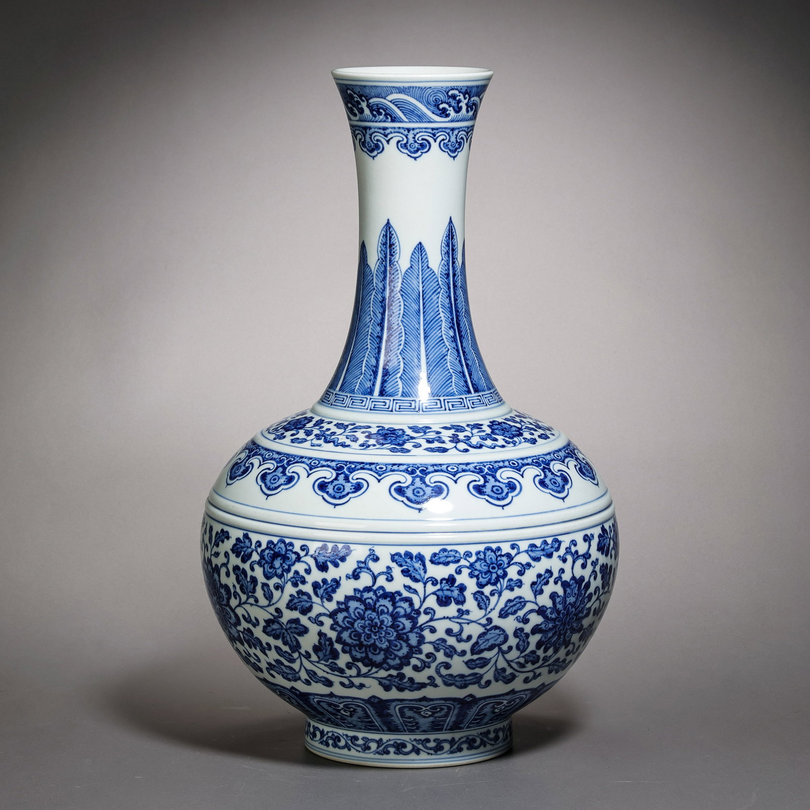 Blue and white porcelain long-necked vase with scrolling floral design from the Guangxu period of (1 of 12)