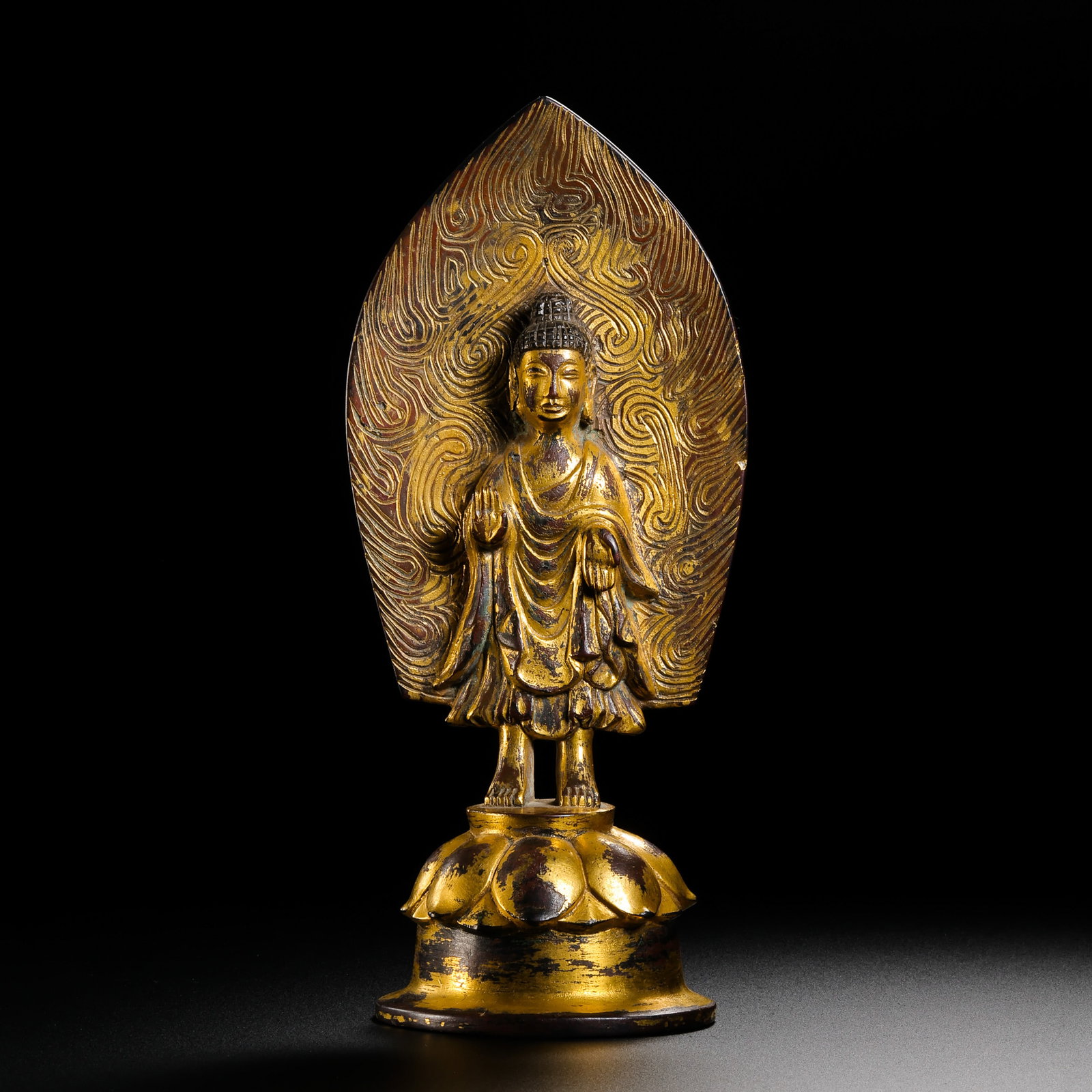 Gilt Bronze Standing Buddha Statue from the Northern Wei Dynasty in China: H . 18.8 cm . L . 8.1 cm . Weight 572 gram .