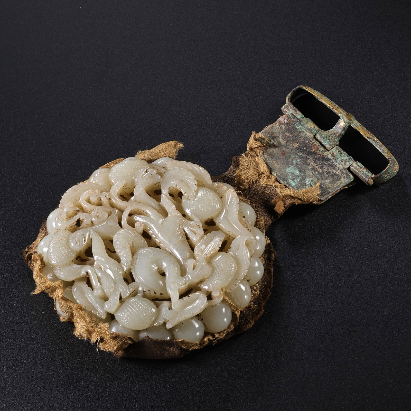 Jade belt buckle from the Liao Dynasty in China: L . 13.5 cm . W . 8 cm . Weight 118 gram .