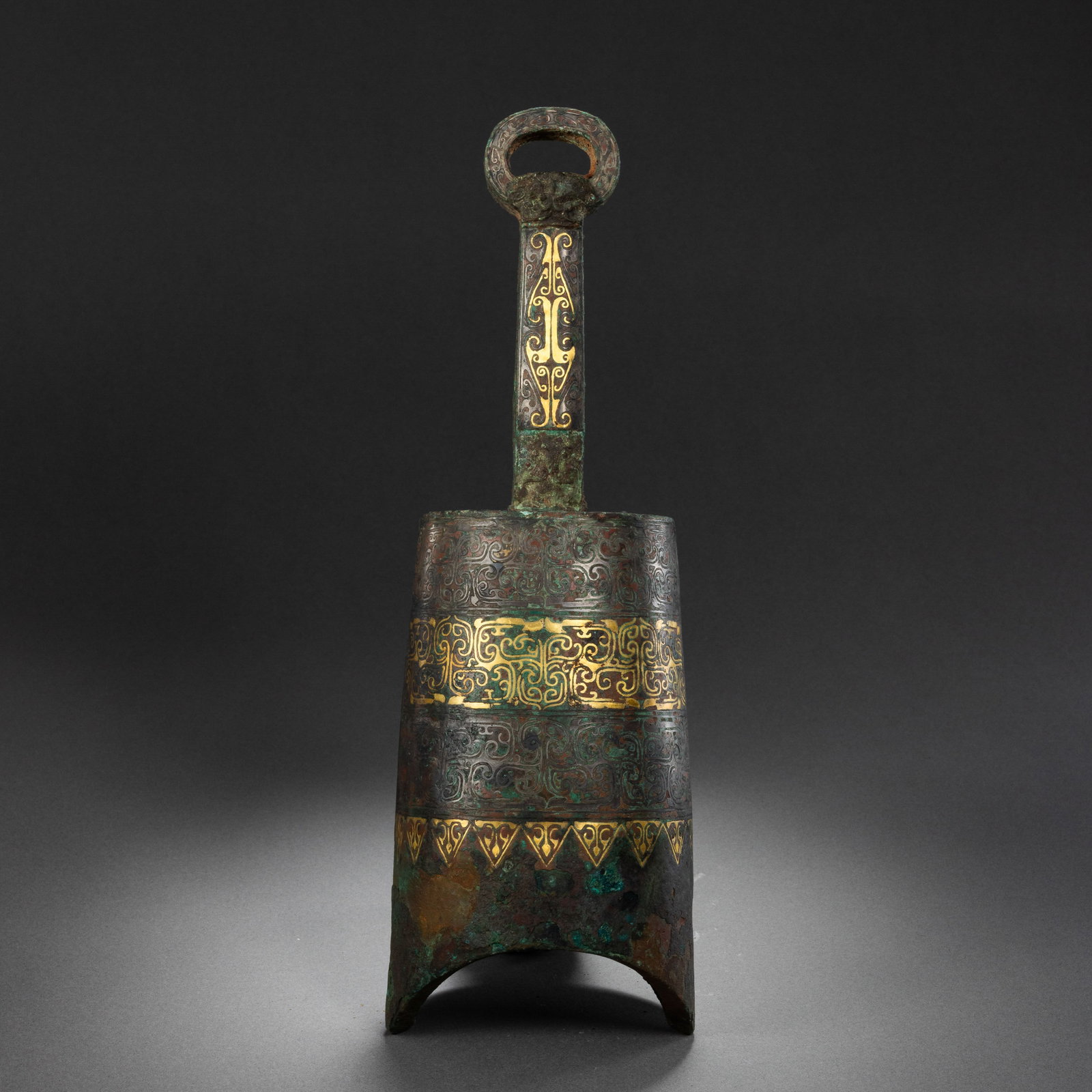 Gold and silver inlaid chime bells from the Warring States period of China: H . 5.8 cm . L . 6 cm . Weight 918 gram .
