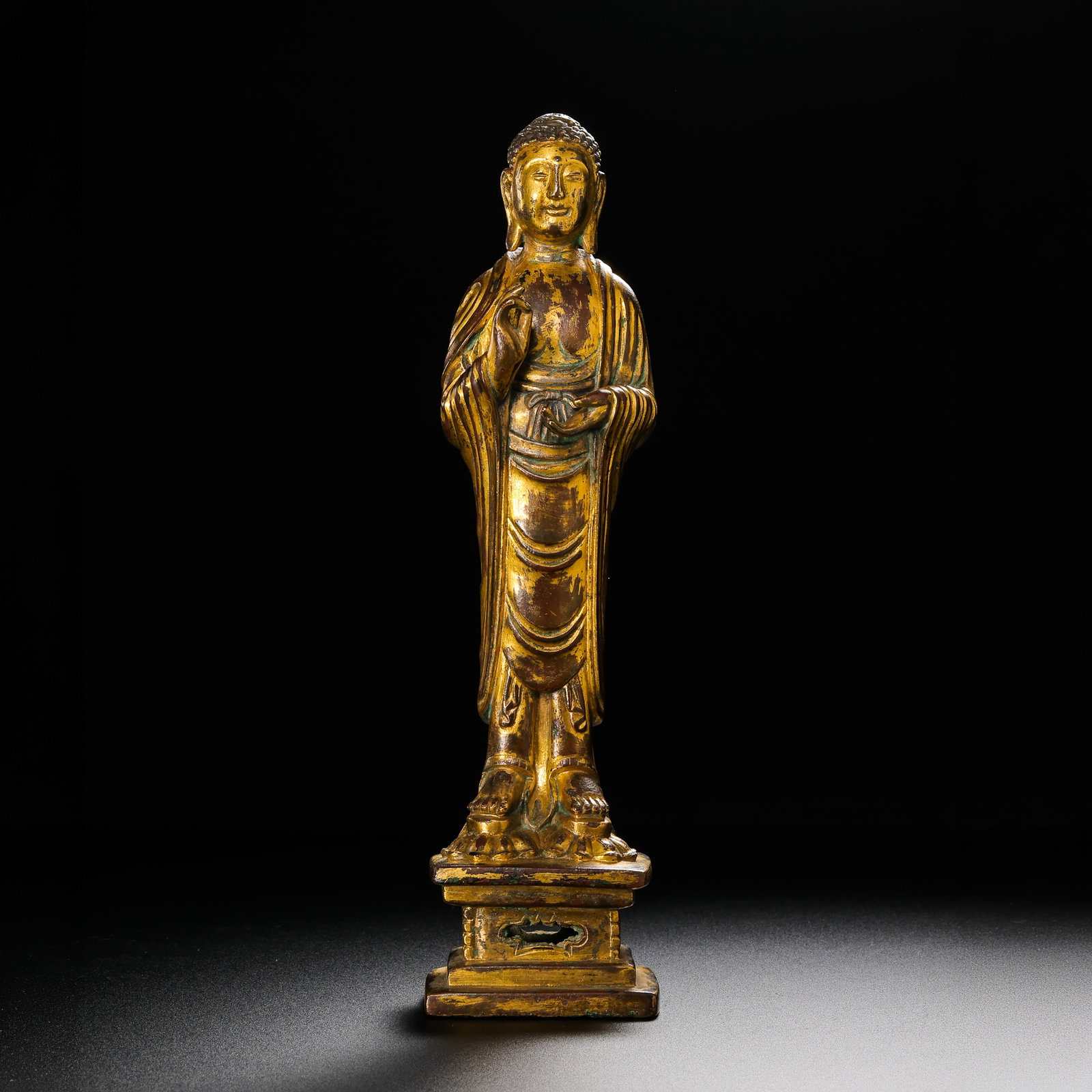 Gilt Bronze Standing Buddha Statue from the Liao Dynasty in China: H . 20.7 cm . L . 5 cm . Weight 755 gram .