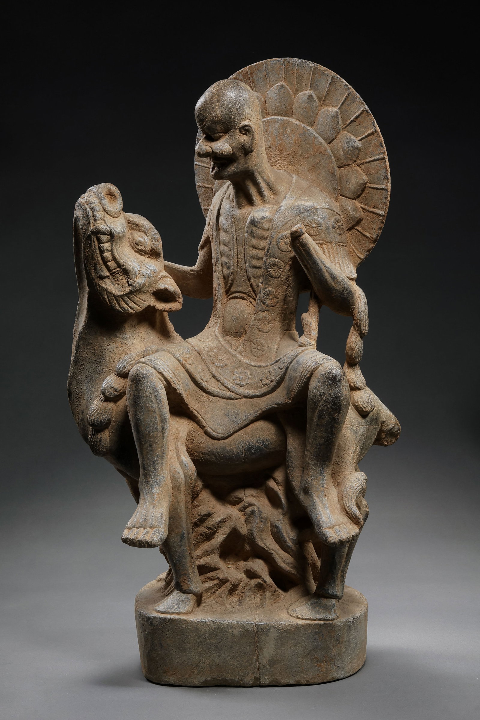 Chinese Tang Dynasty bluestone seated figure: H . 49.5 cm . L . 27 cm .