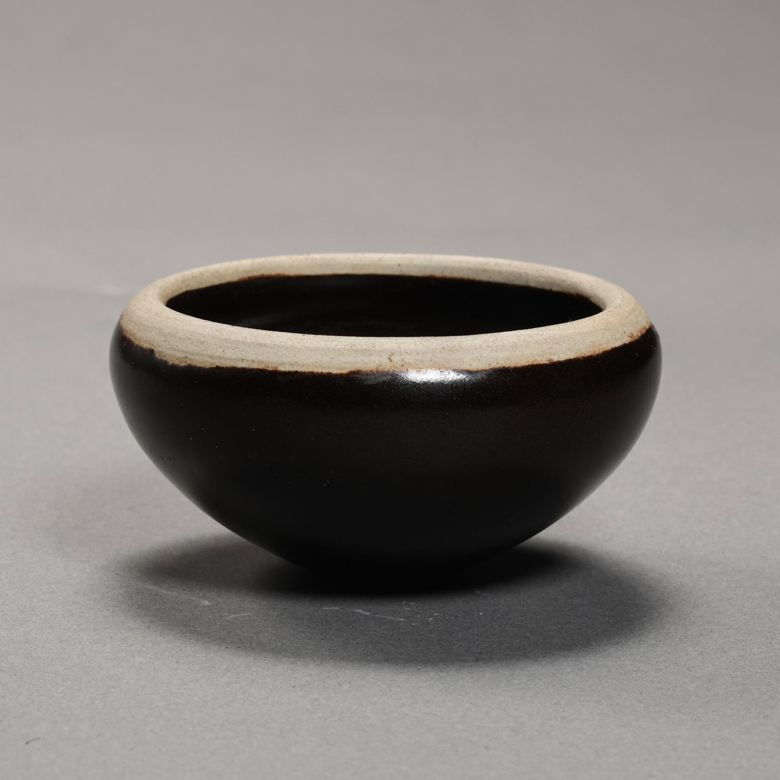 Black-glazed Zibo bowl from Gongxian kiln, Tang Dynasty, China: Diam. 6.2 cm. H. 3.5 cm.