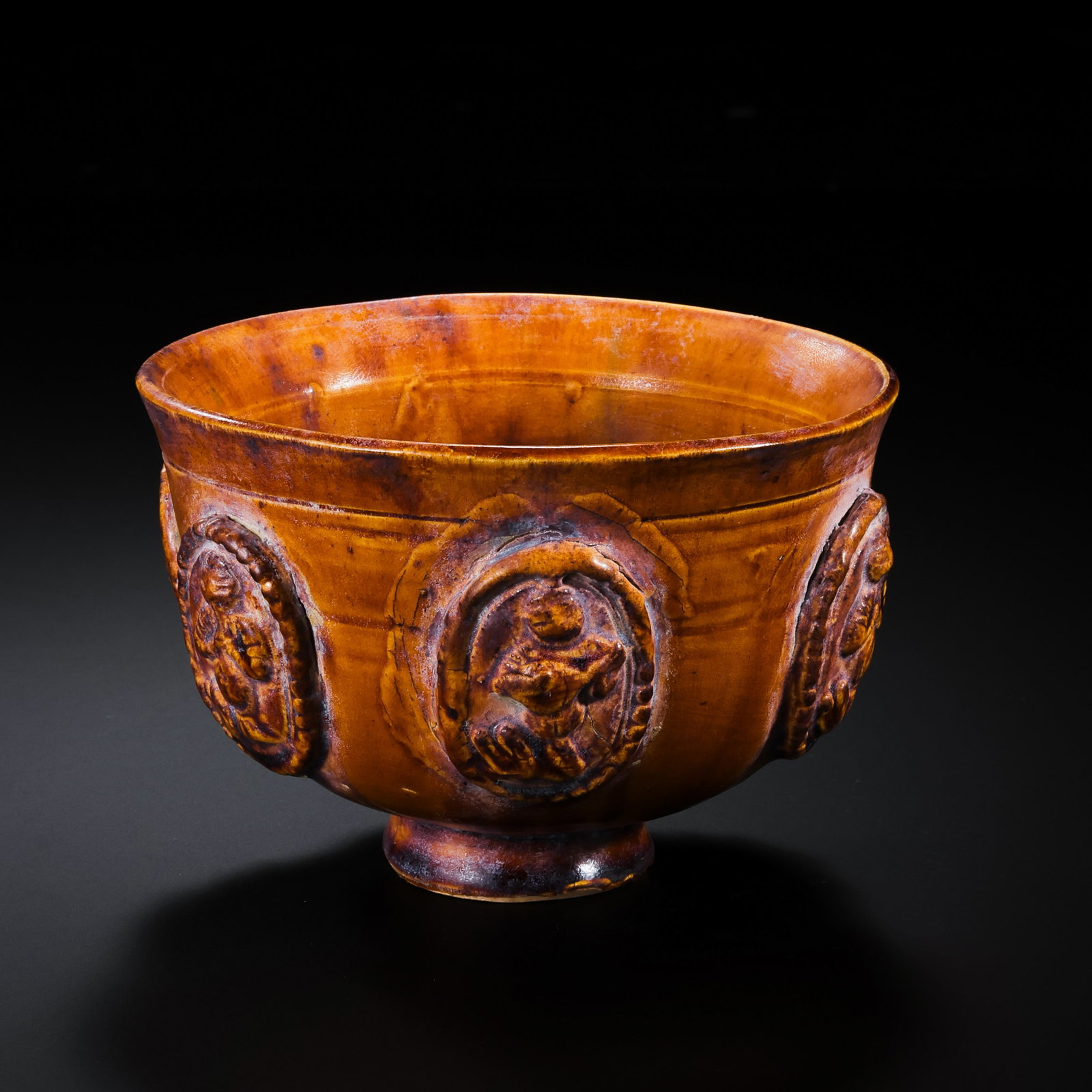 Chinese Sui Dynasty Yellow Glazed Appliqué Cup: Diam. 9.4 cm. H. 6.4 cm.