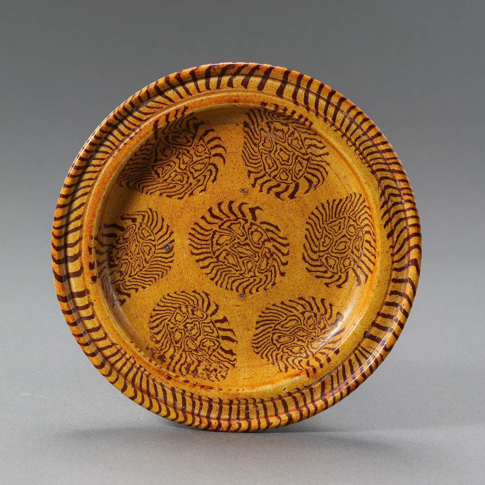 Chinese Tang Dynasty Yellow-glazed Marbled-glazed Dish with Folded Rim: Diam. 11.1 cm.