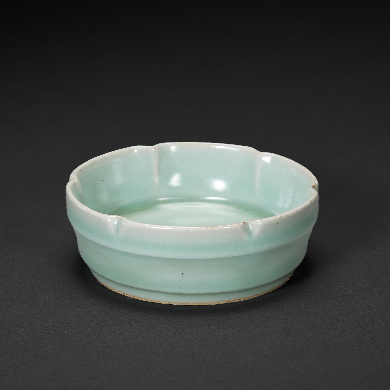 A celadon flower-shaped washer from the Longquan kiln of the Southern Song Dynasty in China: Diam. 10.8 cm. H. 4 cm.