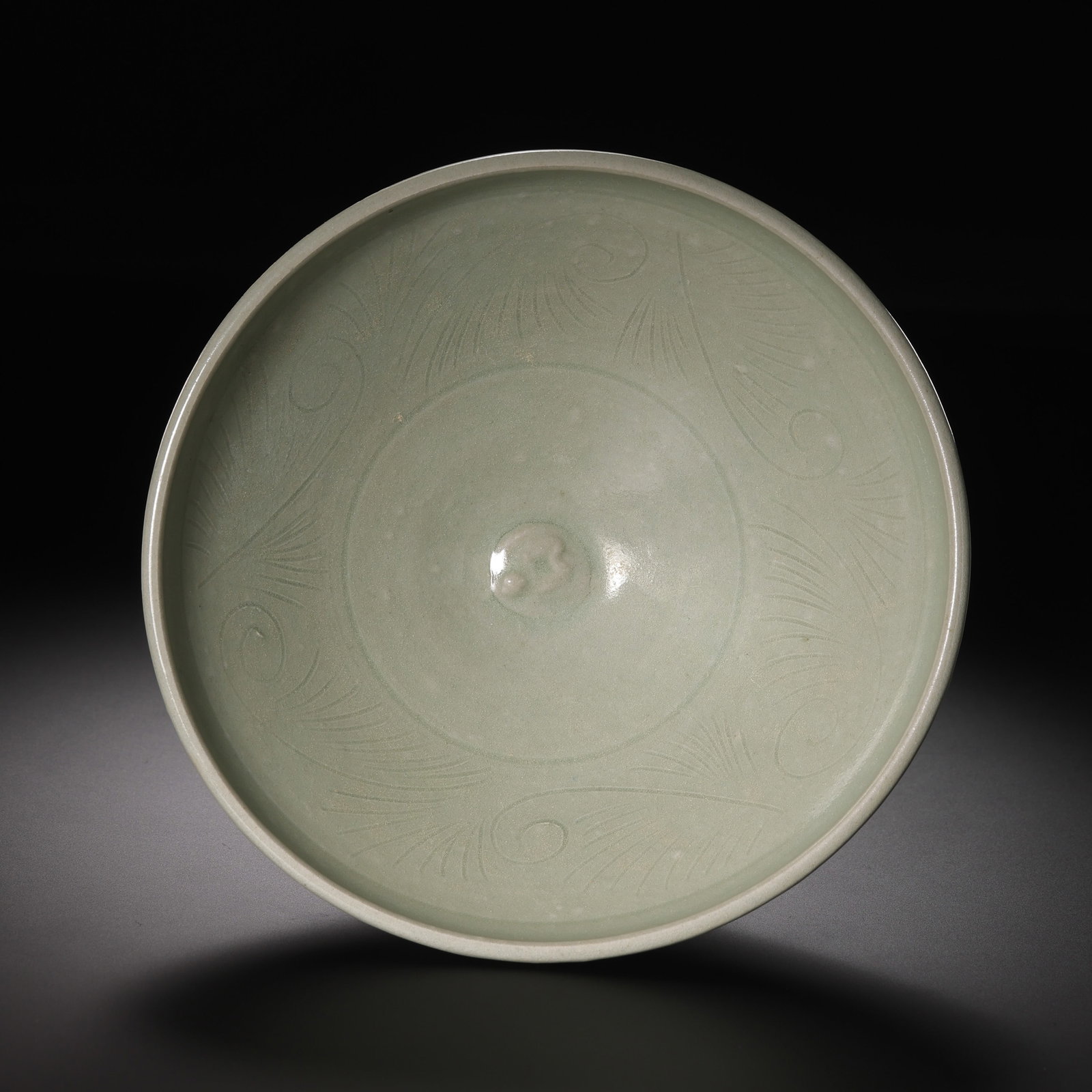 Moon-white glazed cup from Yaozhou kiln during the late Tang and Five Dynasties period in China: Diam. 12.6 cm. H. 4.3 cm.