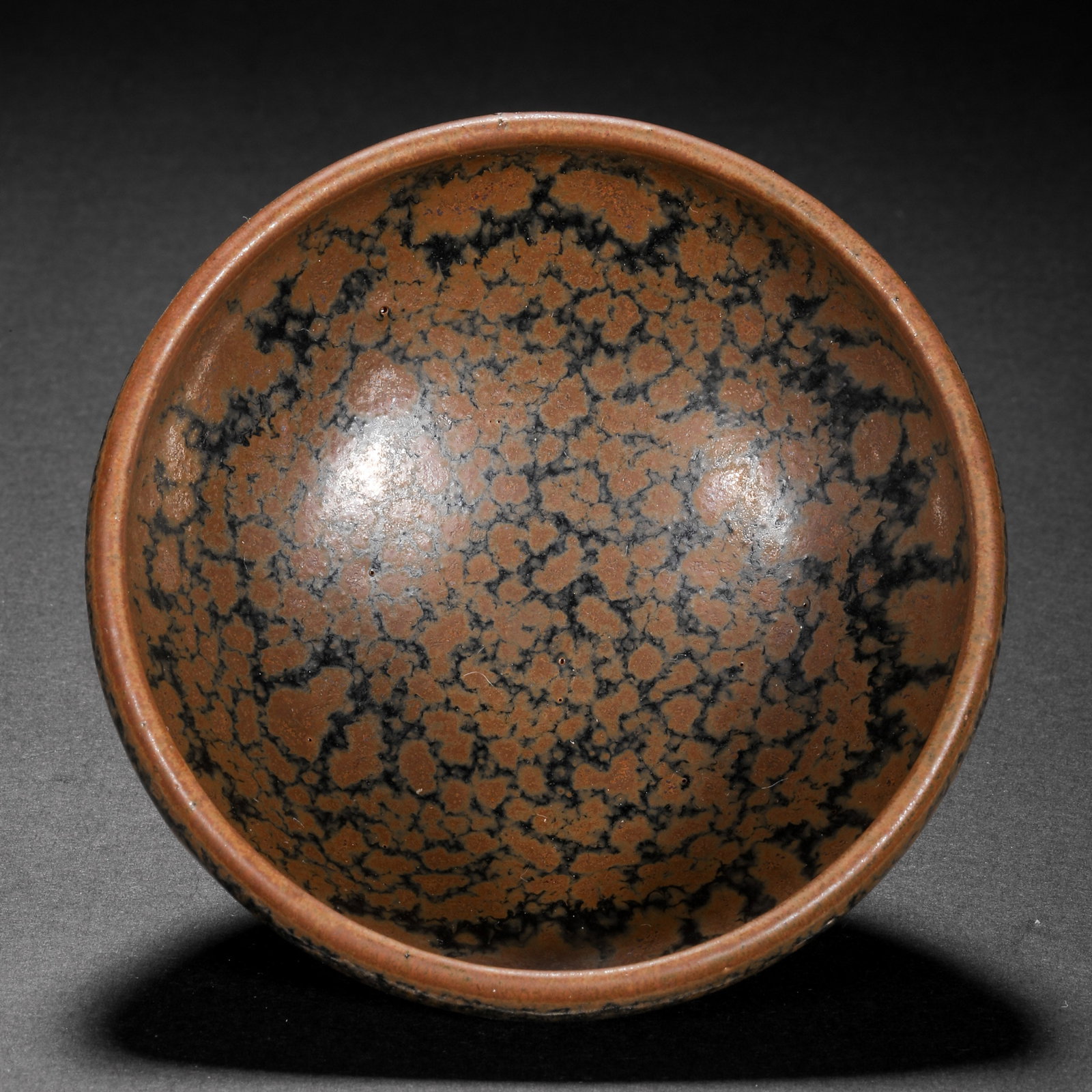Iron-rust-spotted cup from Cizhou ware, Northern Song Dynasty, China: Diam. 9 cm. H. 4.5 cm.