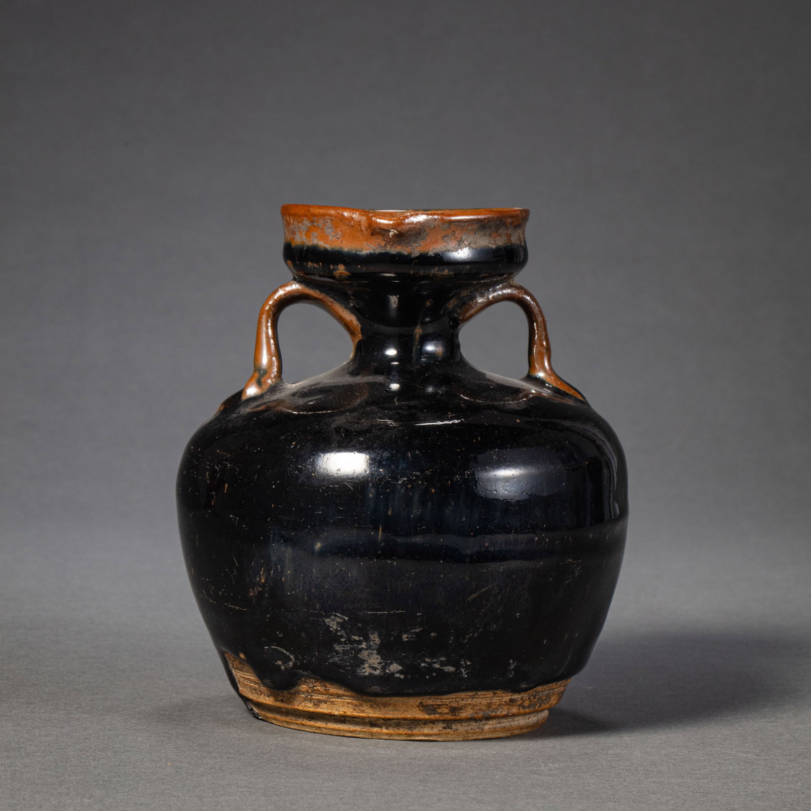 Northern Song Dynasty Cizhou Kiln Black Glazed Double-Handled Flamed Bottle: H. 12.5 cm.