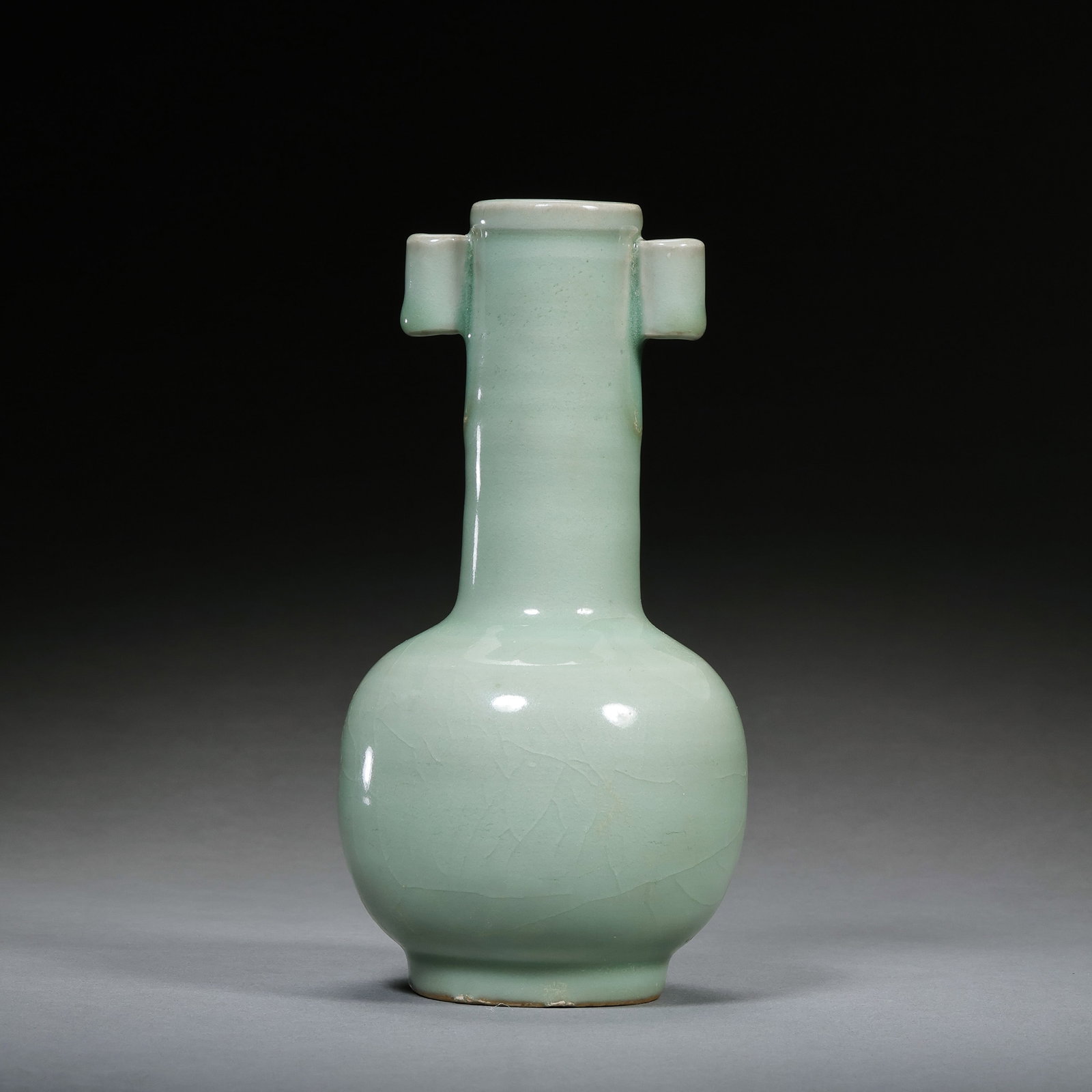 Southern Song Dynasty Longquan kiln celadon vase with tubular handles: H. 17 cm.