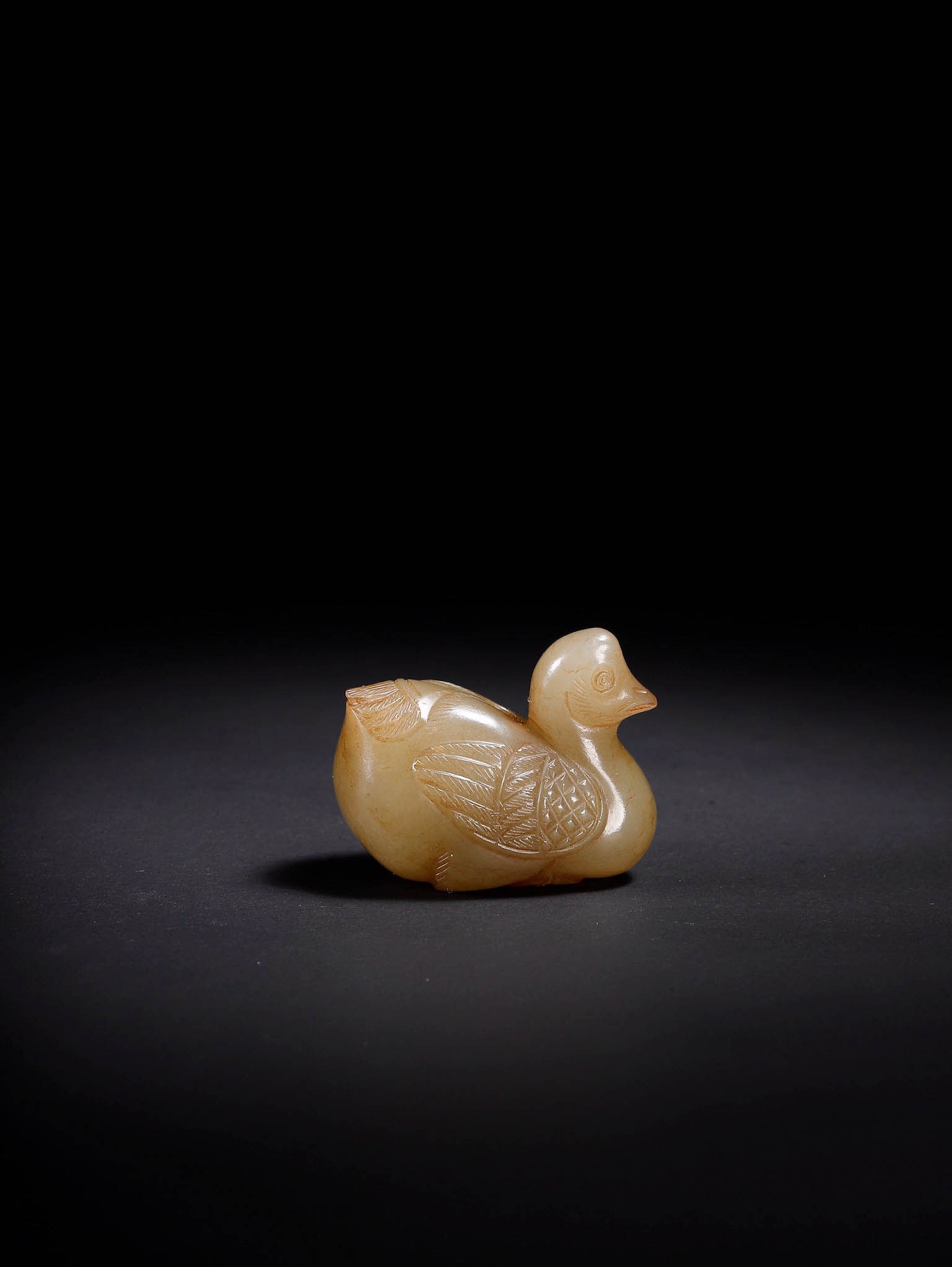 Hetian Jade Duck?Shaped Pendant: Hetian Jade Duck?Shaped PendantSuggested Period: Jin?Yuan dynastiesDimensions: 1.38?×?0.75?×?1.10?inchesWeight: 24.5?gCondition: Fully intact. No breaks, cracks, chips or later repairs. The central