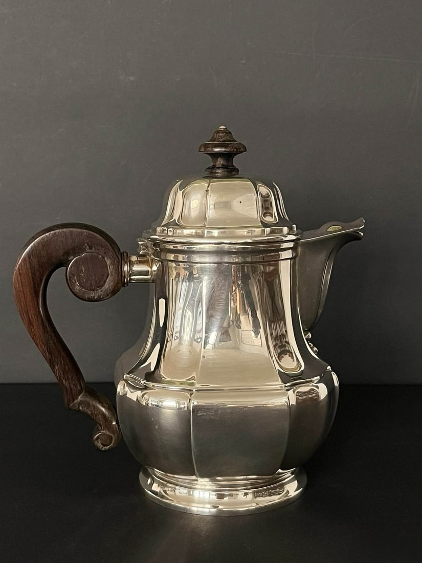 European Antique Silverware, Christofle of Paris, Royal?appointed French Silversmith.: European Antique Silverware, Christofle of Paris, Royal?appointed French Silversmith. Art?Deco?style Sterling?Silver Coffee Pot with Ebony Handle.Specifications: Height 8.35?in; spout?to?handle span