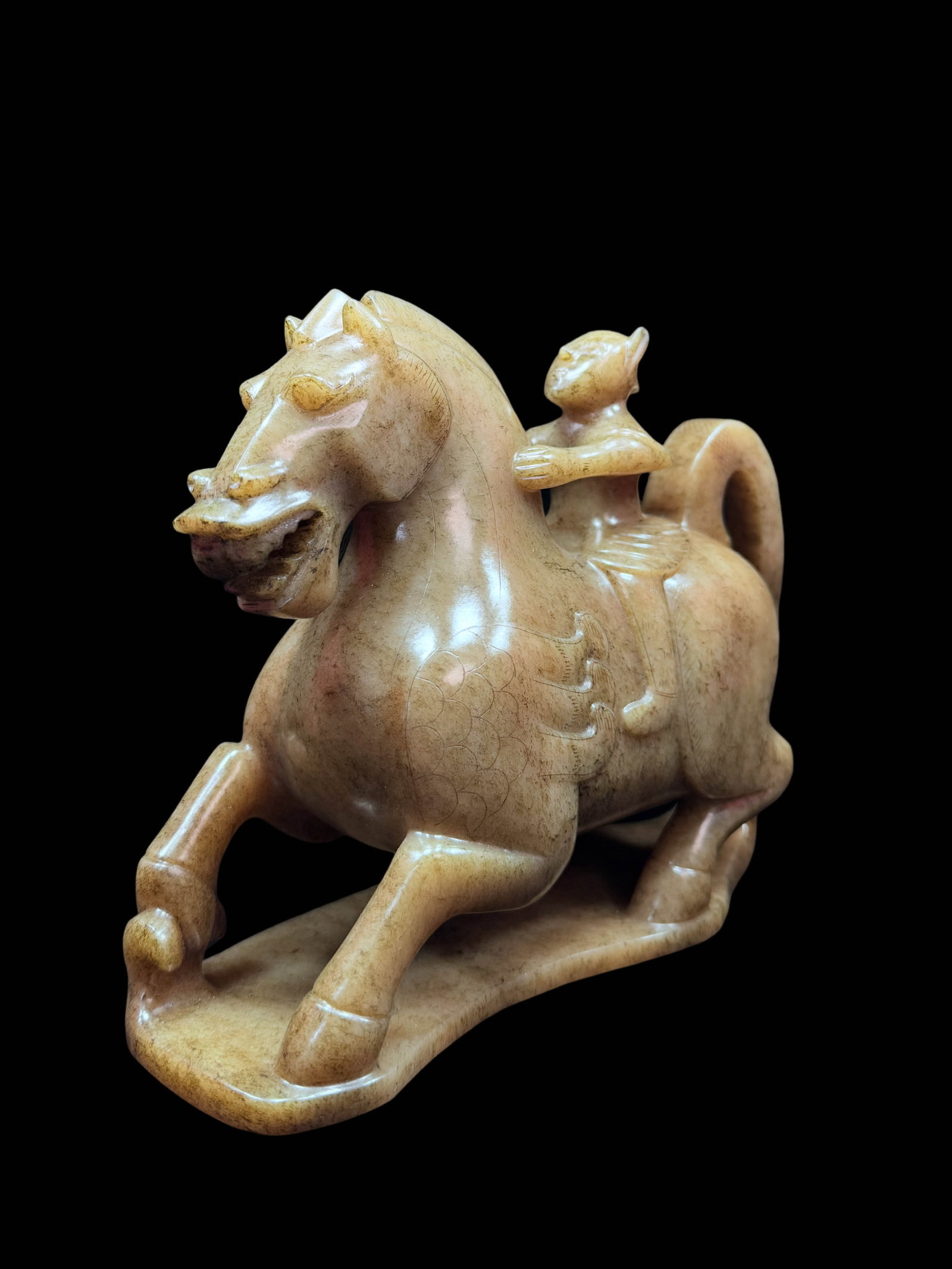 Jade Feathered?Man Riding Winged Horse: Suggested Period: Han DynastyDimensions: Height 17?cm (6.69?in), Length 20.5?cm (8.07?in), Width 8?cm (3.15?in); Weight 2719?gCondition: Fully carved from a single block of jade; the base, horse body