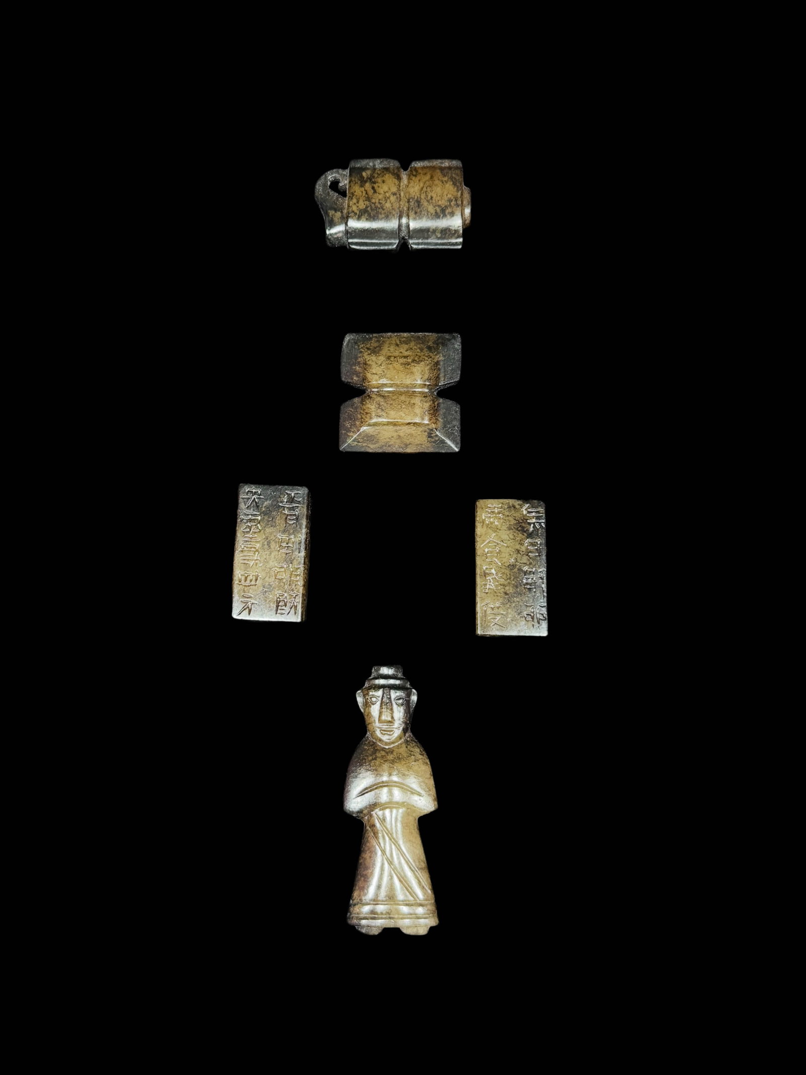 Group of Five Han?Dynasty Warding?Off?Evil Jade Pendants (South?Pointer Pendant, H?Shaped: Group of Five Han?Dynasty Warding?Off?Evil Jade Pendants (South?Pointer Pendant, H?Shaped Pendant, Gangmao & Yanmao, Jade Wengzhong)Suggested Period: Han DynastyDimensions1. South?Pointer Pendant (Si