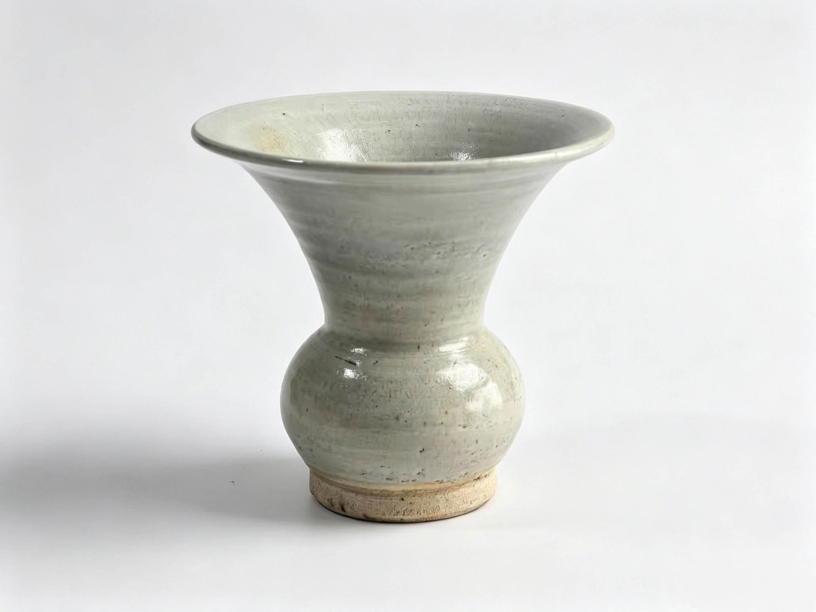 Bluish White Glaze Waste Vessel: Category: Bluish White Glaze Waste Vessel (Zhadou)Kiln Line: Local Bluish White Porcelain Kilns of the Song and Yuan DynastiesShape & FormThis piece follows the classic form of an ancient zhadou, a